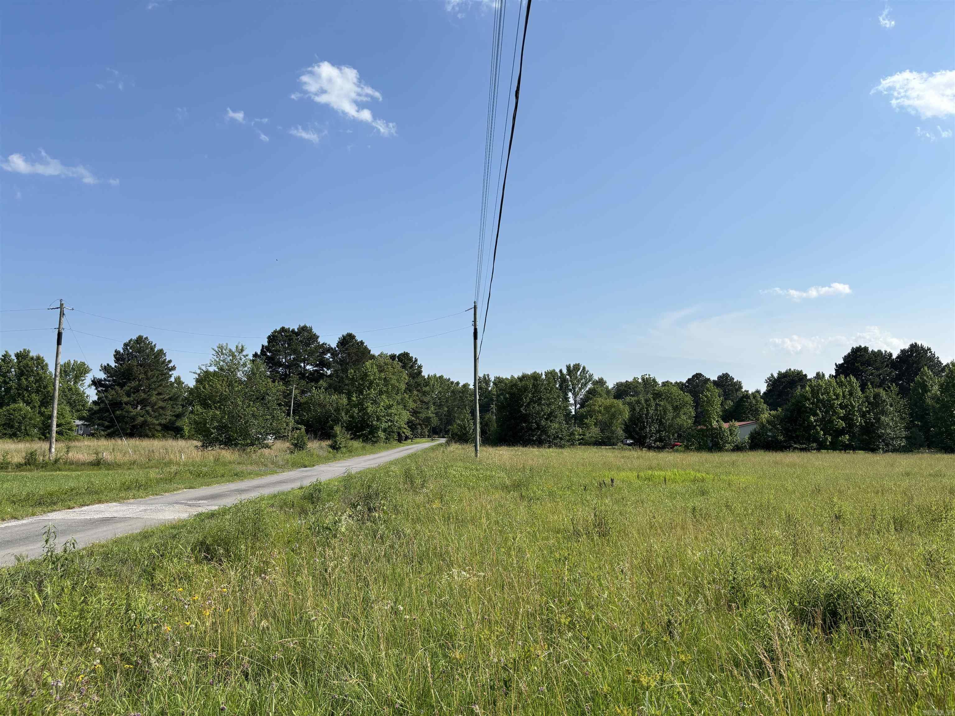 7.5+- acres of pasture outside Ward City Limits. Owner has raised cows in the past. Good quality grass, Home Sites, Development, or use as an investment for future growth appreciation. City of Ward Arkansas is growing and this land is level with good drainage, rural Water, Electric, existing septic system is functional. Old mobile home and outbuilding on site. Raise some critters or build a home with plenty of room around you.