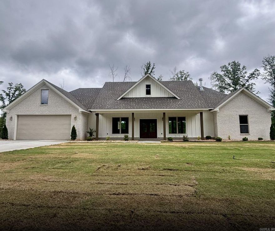 New construction home in the growing area of Bauxite! This custom-built property offers 3 bedrooms, 2.5 baths, and 2,227 sq ft of well-designed living space. The open-concept layout features vaulted ceilings with beams and a floor-to-ceiling brick fireplace with built-ins as a focal point of the living area. The kitchen is equipped with double ovens, a large island, and ample space for cooking and entertaining. The primary suite includes a spacious en-suite bath and large walk-in closet. Situated on a 0.89-acre lot, this home provides both space and comfort. Schedule your private showing today!
