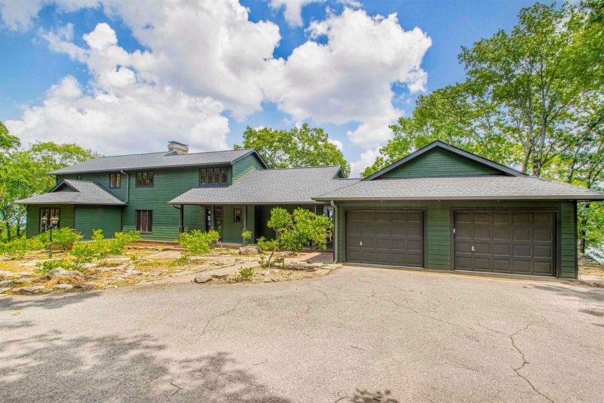 Nestled atop Petit Jean Mountain with panoramic views of the Arkansas River Valley, this custom 4-bed, 3.5-bath retreat blends rustic charm with modern comfort. Set on 2.51 wooded acres, this 3,255 sq ft home features soaring ceilings, hardwood and tile floors, and abundant natural light. The spacious living area centers around a gas-log fireplace and a wall of windows framing breathtaking scenery. The kitchen offers granite tile counters, stainless appliances, ample cabinetry, and flows seamlessly into a dining space overlooking the valley. The primary suite boasts vaulted ceilings, a private balcony, and a spa-like en-suite. Upstairs includes additional bedrooms, a charming bunk room, and a bonus loft for relaxing or entertaining. Step onto the expansive deck for unforgettable sunsets and outdoor living. Minutes from Petit Jean State Park, this home is perfect as a full-time residence, vacation home, or short-term rental.