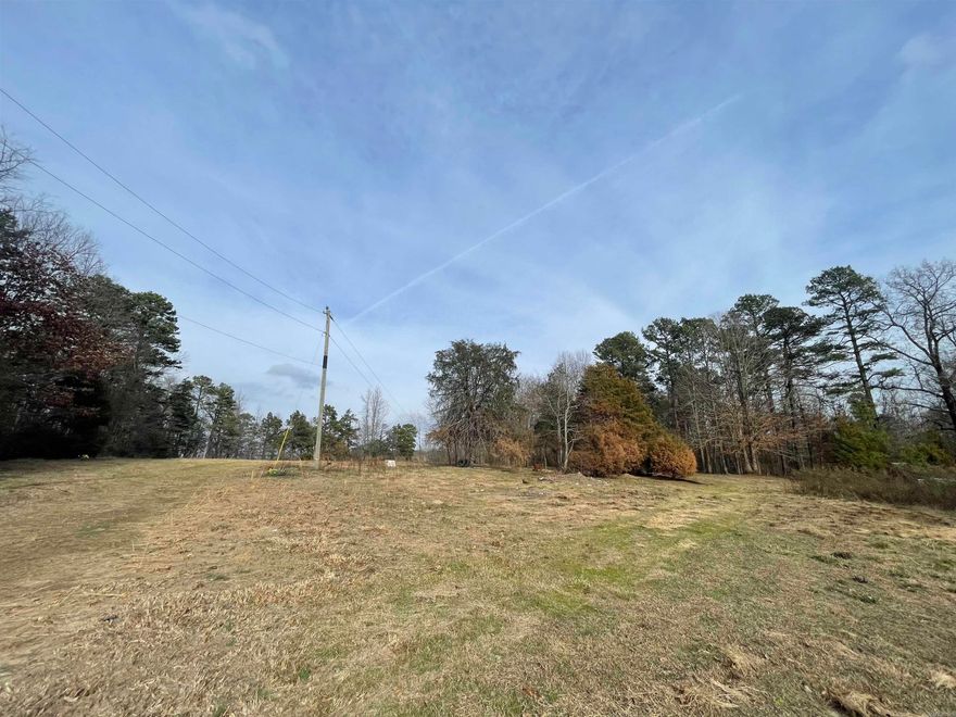 Perfect spot in the country to build your dream home or put a mobile! 5+ acres with a pond. Electricity, public water, well, and septic system on the property. There are a few older mobile homes on the property to convey at no value. Agents see remarks.