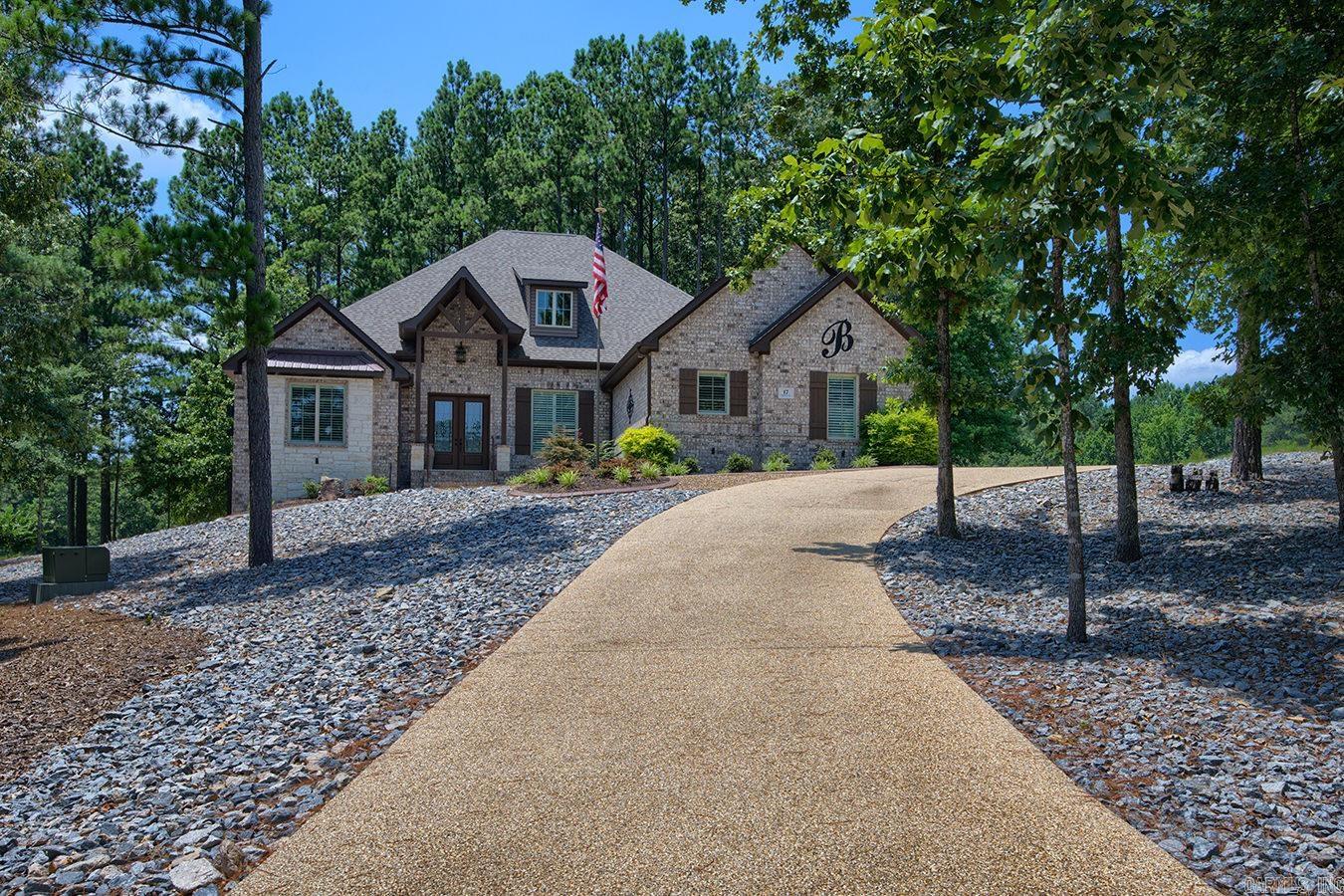 Castle on a hill, beautiful setting on the golf course #3 Nina and #9 Pinta, approx. 1.22 acres. Open plan with high volume ceilings, granite counters, wood floors, wood ceiling in great room, gas fireplace, formal dining area, office, 3 bedrooms with guest on opposite side for privacy. 3 and 1/2 baths, lots of storage and built ins. breakfast area has built in hutch and there's more than enough cabinet space including a walk in pantry. Gas range, double ovens, microwave, refrigerator- washer/dryer included. Plantation shutters, ornate trim, huge walk in master closet. Inside access to attic storage. 3 Car Garage with side load entrance. Covered Patio with tile floors. It's just a spectacular home with mega features. Priced at $659,000 for approx. 3300 sq. ft h/c built in 2020.