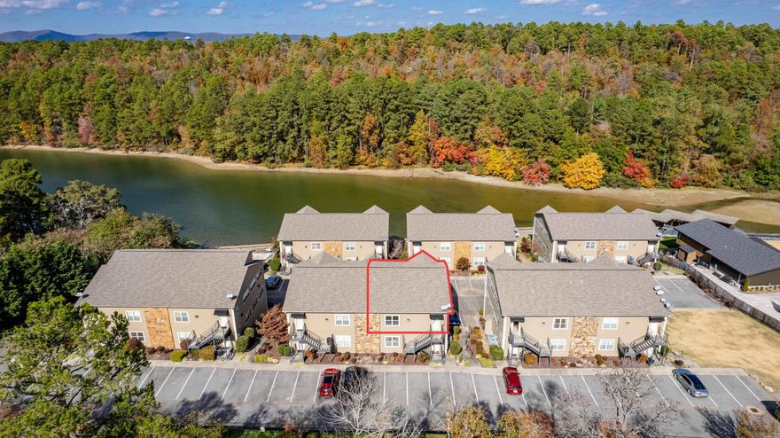 Bright and an open concept floorplan all with a lake view!! The high ceilings and gas fireplace will give you the best of both worlds.  The kitchen is well appointed with stainless appliances to prepare the best of foods to enjoy for a boat ride or while sitting on your balcony overlooking the water.