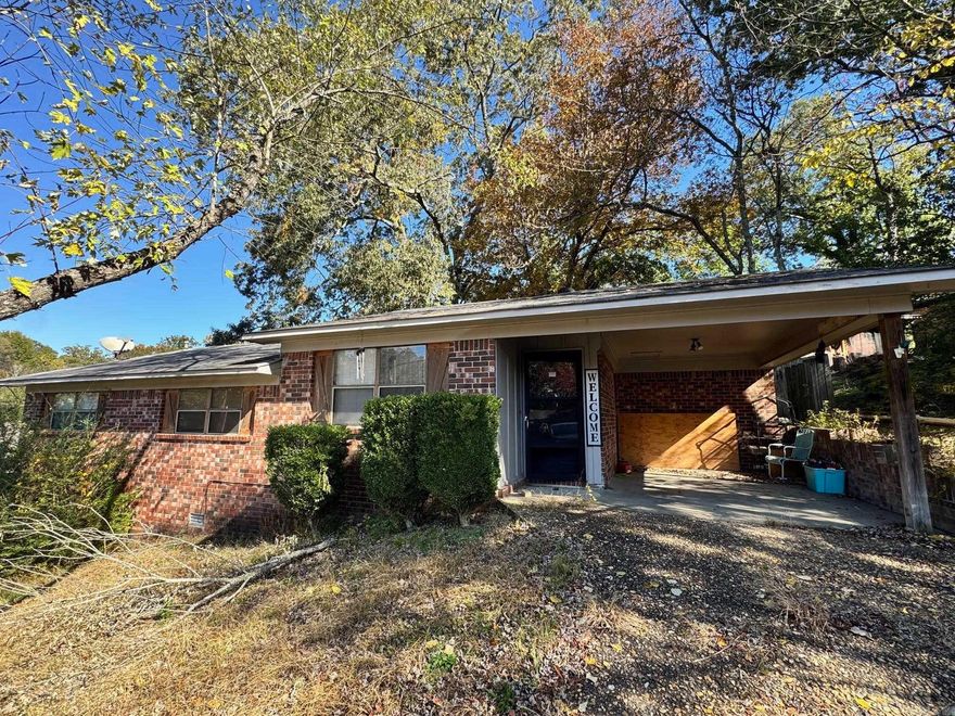 Located just a couple of blocks from Hot Springs’ World Class High School, this brick home offers a great opportunity for anyone looking to invest, renovate, or make it their own. The main level features a cozy living room with natural light, a eat-in kitchen and dining area with sliding doors that open to the backyard, and three comfortable bedrooms. Outside, the home sits on a tree-shaded lot with a covered carport and easy access to nearby schools, parks, and shopping. With some updates and personal touches, this property has the potential to shine!