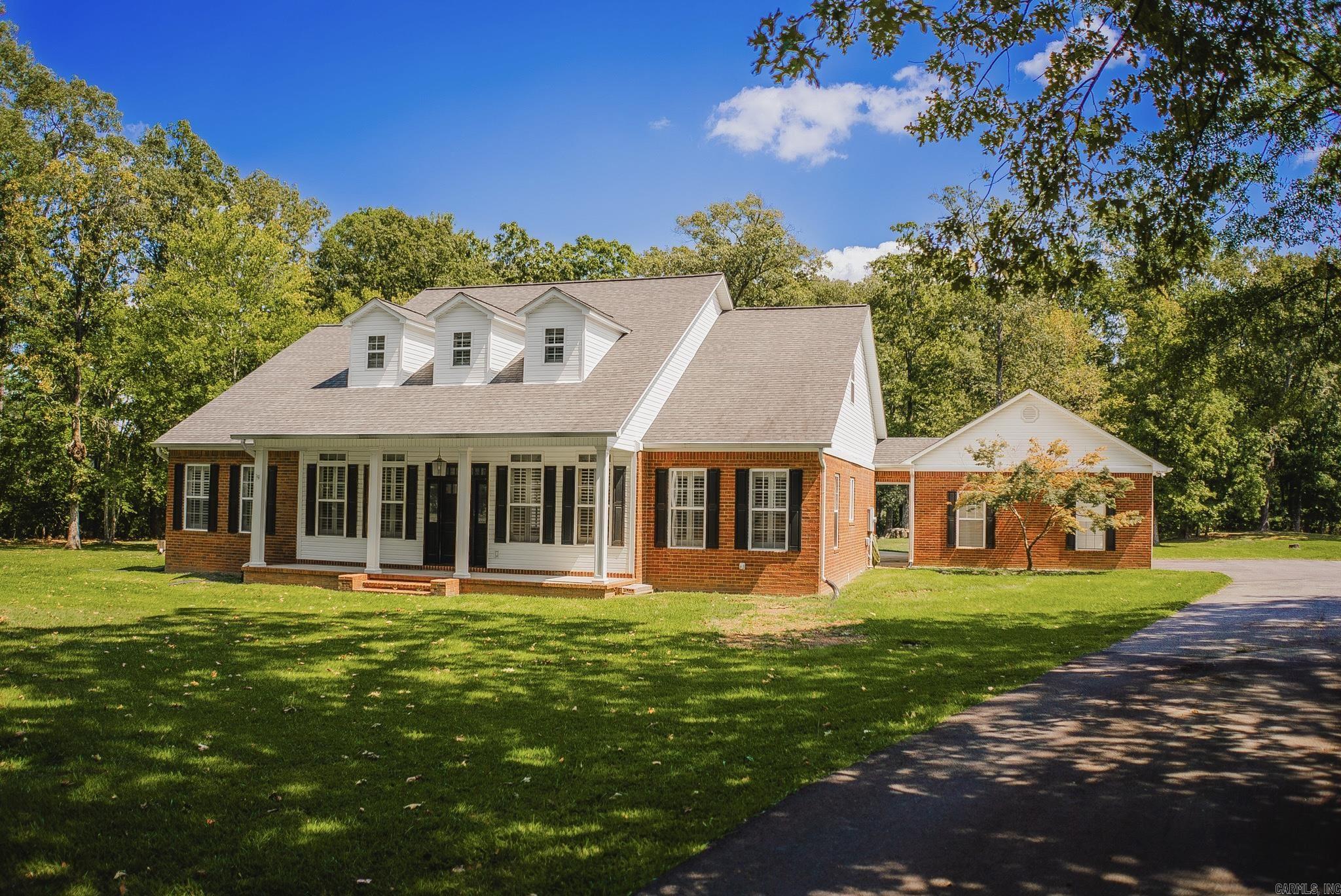 Beautiful two-story traditional home on 3 wooded acres with mature shade trees, just minutes from town! This 4-bedroom, 4-bath home features the primary suite and an additional bedroom on the main level. The updated primary bath includes a freestanding tub for a relaxing retreat. Gorgeous wood floors flow throughout, and the office offers custom built-in bookshelves. Upstairs are two more bedrooms, two full baths, and a large bonus room ideal for a media or playroom. Enjoy the private backyard with a pool and attached potential pool house or mother-in-law quartersāalready wired, walled and equipped with a mini-split, ready for finishing touches. A perfect blend of comfort, style, and outdoor living!