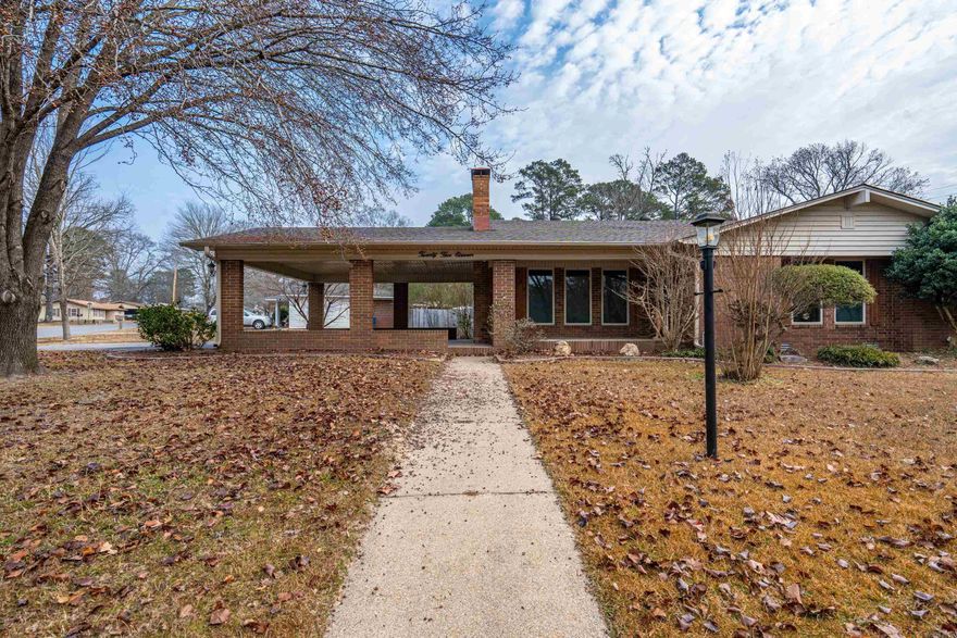 Don't miss seeing this home in a great neighborhood offering the perfect blend of convenience and quiet living. Located close to town, this well-maintained home features a spacious floor plan with plenty of room to spread out, including a separate den. Enjoy relaxing on the covered back porch overlooking the backyard with beautiful flower beds. The home sits on a large corner lot and offers a double carport for ample parking. Inside you’ll find three bedrooms and two and a half bathrooms, with the primary bedroom featuring three closets. Freshly painted interior and a new roof completed in 2024 make this home move-in ready.