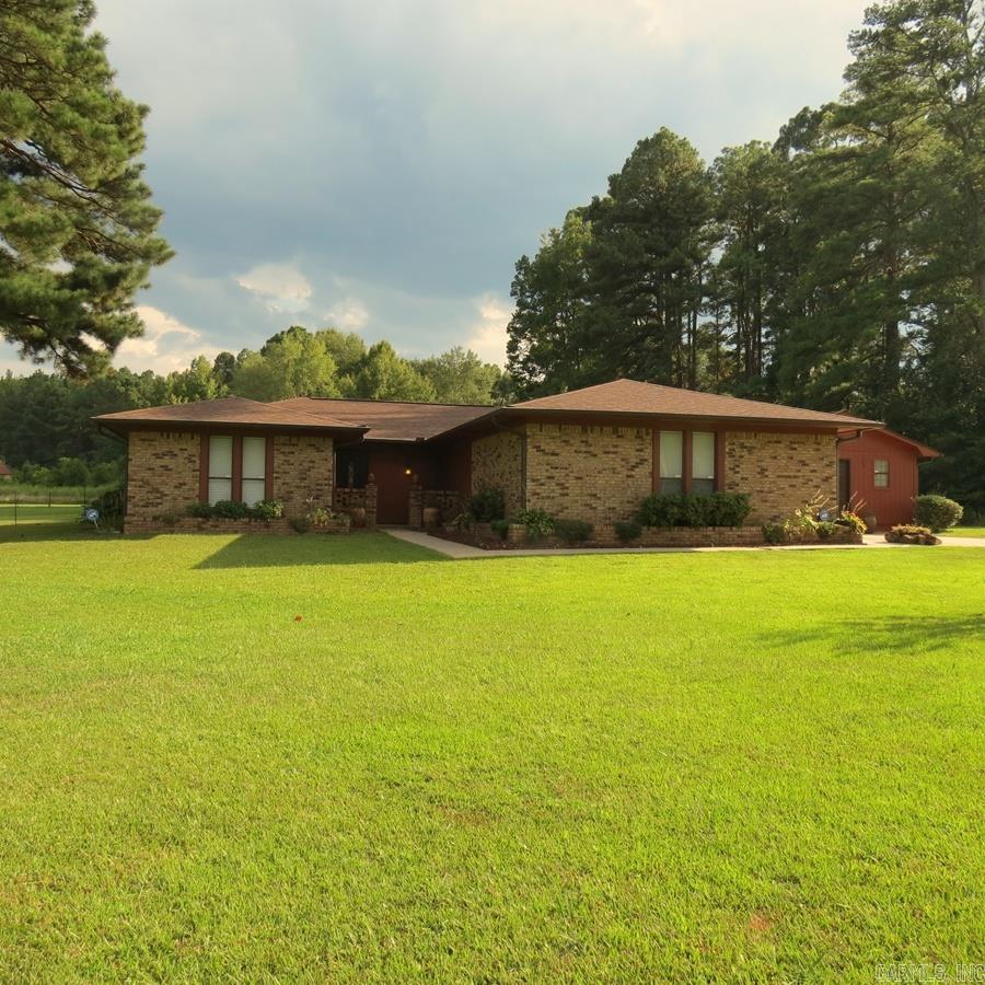 Welcome to your dream home!! This well-maintained home sits on 1.25 acres and offers 4 bedrooms, 2 baths, 2 living areas, large pantry/butler pantry. This home has had many updates, all electric and set up for a generator. Roof/gutters 5 years old, New septic tank 2021, hot water heater 2023, flooring 2022. Fireplace. Step into your backyard oasis, featuring a fenced 20x40 inground pool with new liner. Pool house. Additionally, the home features a versatile shop with electricity. Small storage building. Refrigerator, washer/dryer and window unit in shop all Convey with the property. Don't miss your chance to make this incredible property your own!