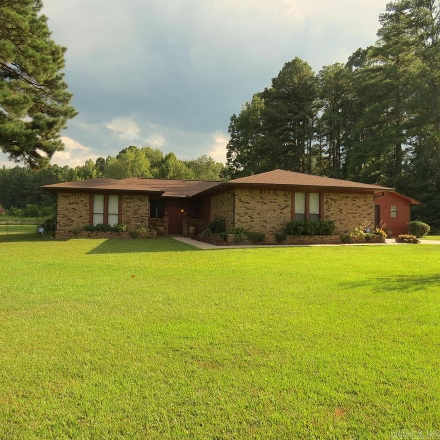 Welcome to your dream home!!  This well-maintained home sits on 1.25 acres and offers 4 bedrooms, 2 baths, 2 living areas, large pantry/butler pantry.  This home has had many updates, all electric and set up for a generator. Roof/gutters 5 years old, New septic tank 2021, hot water heater 2023, flooring 2022.  Fireplace.  Step into your backyard oasis, featuring a fenced 20x40 inground pool with new liner.  Pool house.  Additionally, the home features a versatile shop with electricity.  Small storage building.  Refrigerator, washer/dryer and window unit in shop all Convey with the property.  Don't miss your chance to make this incredible property your own!