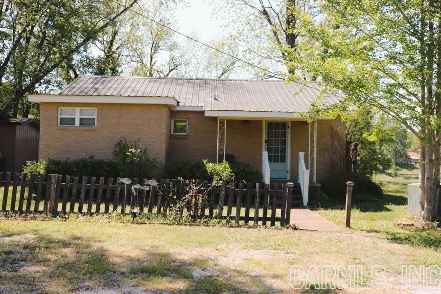No.02272- White River Brick Home For Sale in Mountain View AR- This home is located just a short 10 Minute drive to the beautiful down town of Mountain View where you will find great shopping, places to eat, and music on the square. The home is just a ¼ of a mile from Jack’s fishing resort and JoJo’s Catfish Warf. It overlooks the beautiful White River that is home to world class trout fishing. The home would be a great full time residence or weekend getaway that could also be an Airbnb. It has 2 bedrooms, 2 bathrooms, with 1,300 square feet. It has been well maintained and had many updates over the years. The home is being sold fully furnished so all you will need is your suitcase. There is a screened in back porch, fire pit, brand new decks, fenced for your 4 legged friends and beautifully landscaped. Perfect place to drink your morning cup of coffee and watch the fishermen float by. Come see the peace and tranquility that the Ozark Mountains has to offer. Call today. $275,000.