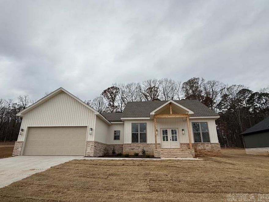 Discover the perfect blend of elegance and comfort in the stunning all-brick, Acadian style home. With 4 spacious bedrooms and 2 luxurious bathrooms, this exquisite property offers an inviting retreat for both relaxation and entertainment. As you step through the front door, you'll be greeted by an expansive living area bathed in natural light, thanks to the large windows that highlight the beauty of your surroundings. Culinary enthusiasts will adore the kitchen and large pantry for extra organization and storage. The custom tile shower in the primary bathroom adds a spa-like experience to your daily routine. Outdoor living is equally impressive with a large, covered patio providing the perfect backdrop for weekend entertainment. Additional features include a two-car garage offering ample parking space and storage. This home is a haven of sophistication and warmth, ready for a family to create lasting memories.