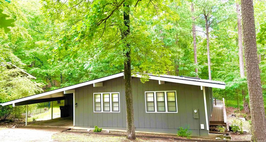 Hurry to see this Absolutely adorable little 3 bed/ 2 and 1/2 bath cottage!!! This little cottage has a really cool contemporary flare and you could easily fit with your style with the neutral colors!  With a  price is so affordable for a newly wed couple or a small family! It would also be perfect for a second little getaway home!  The exterior newly painted!!! New roof!!! lovely decks on back and on the side for outdoor entertaining!! And a lovely fenced in back yard for you pets!! The living room has lovely cathedral ceilings with rustic wood beams and huge picture windows for viewing the outdoor setting! lovely newer laminate flooring with a cozy feel!!  It also has a huge screened in porch for your enjoyment without the hassle of bugs you can barbecue off the lovely deck and eat right there in your screened in porch its so relaxing and private and large enough for entertaining family and friends!!  The galley kitchen is just perfect! Bright and white with new floors and sky light its brings in the natural light and its just right off the dinning area! It has a very large pantry. Includes Refrigerator, microwave, dishwasher!! There are 3 bedrooms and 2 and 1 half baths , 2 of t