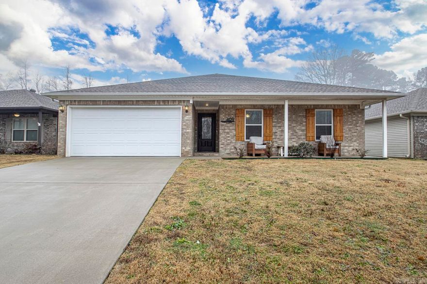 Take a look at the beautiful 4 bed, 2 bath home that has been meticulously maintained and feels like new construction! The finishes in this home are far from standard and include tile and hardwood flooring throughout (no carpet), granite counters, stainless steel appliances, tons of custom trim plus the Washer, Dryer and Refrigerator convey!!  This home also features a well thought out, split floor plan and plenty of covered porch space overlooking the large fenced back yard!!