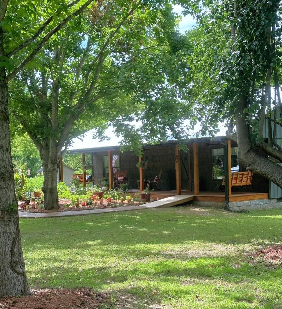 Welcome to 532 Hayden Heights Road – Rustic Elegance in the Heart of the Ozarks An inviting 2 bed/2 bath home built in 2022 with 1,316 sq ft of rustic charm. Nestled on two spacious lots just steps from the White River, this property blends handcrafted details with modern convenience. Inside, you'll find custom boxcar wood accents, handcrafted doors and cabinets, and a cozy open layout with wood & tile flooring. Two electric mini-split HVAC systems plus gas log backup ensure year-round comfort. All appliances stay, & the home has public water & private septic. Enjoy the screened porch, covered patio, & a large workshop with room for projects or an animal sanctuary. Located just a stone’s throw from the White River, this property offers easy access to world-class fishing and outdoor recreation. Set in a quiet & quaint subdivision, it’s the perfect retreat from the hustle and bustle. Whether you're seeking a full-time residence, weekend getaway, or vacation rental opportunity, this home is ready to welcome its next chapter. Don’t miss your chance to own a unique piece of Mountain View charm – schedule your private tour today!