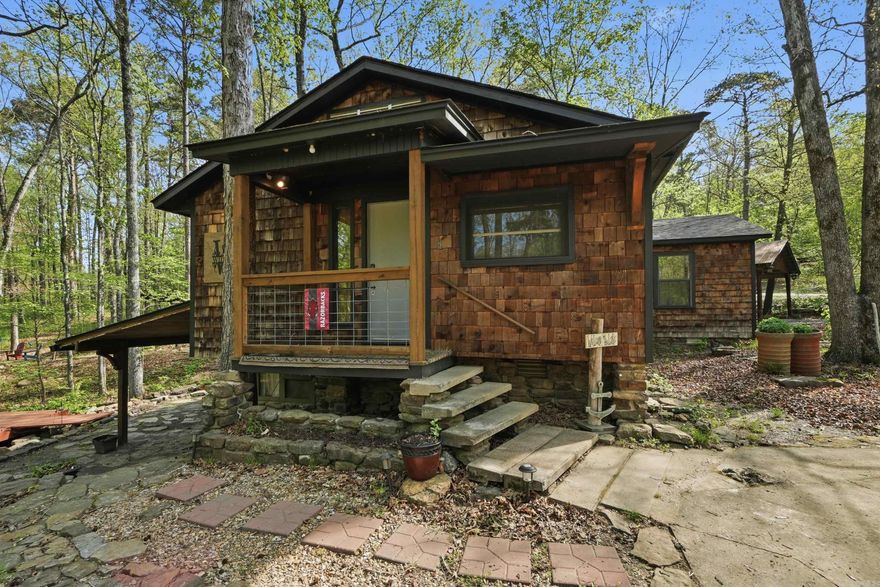 Your Lake Escape Starts Here!  Tucked away in the peaceful beauty of Frontier Canyon, this charming cabin is the kind of place that instantly feels like home… or your perfect getaway.  This 2 bedroom, 2 bath cabin offers 1,168 sq ft of cozy, functional space with a basement for extra room—perfect for guests, storage, or a second living area. Built in 1996, but thoughtfully maintained with a roof and HVAC system just 3 years old, giving you peace of mind for years to come.   A private 6-foot wide maintained trail that leads you straight from your property down to the lake. Imagine morning walks to the water, evening sunsets, and easy access whenever you want it.  And just when you think it couldn't get better.... A beautiful creek runs through the property, adding that peaceful, nature filled setting everyone is looking for.  The boat launch is just ONE minute away, making lake days effortless and spontaneous.  Plus, you'll have ample storage with a shop and shed on the property giving you space to store your lake toys, tools, and more.  Whether you’re looking for a weekend retreat, full-time lake living, or an investment opportunity—this one checks all the boxes.