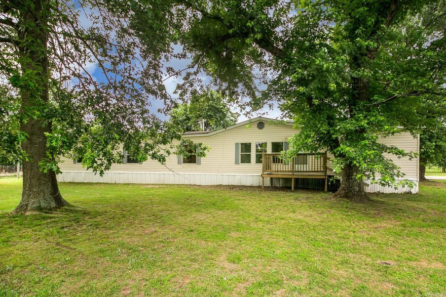 Don't you blink—this is the kind of place where you can finally stretch out and breathe! With 8 bedrooms and 4 bathrooms between the main home and a separate apartment, you’ll have all the space you need for family, guests, or even that rental income you’ve been thinking about.  Sitting on 3 beautiful acres at the end of a quiet road, you will not find another like it! Picture yourself gathering fresh eggs from the chicken coop, tending to goats, or growing your own food year-round in the greenhouse and raised garden beds.  Need space for your hobbies or side gigs? You’ve got two shops and a heated and cooled storage building, ready to bring your ideas to life. And when it’s time to unwind, the kids can enjoy the playground while you relax under the trees or plan your next big project.  Do not wait or this will be someone else's dream come true! SEE AGENT NOTES