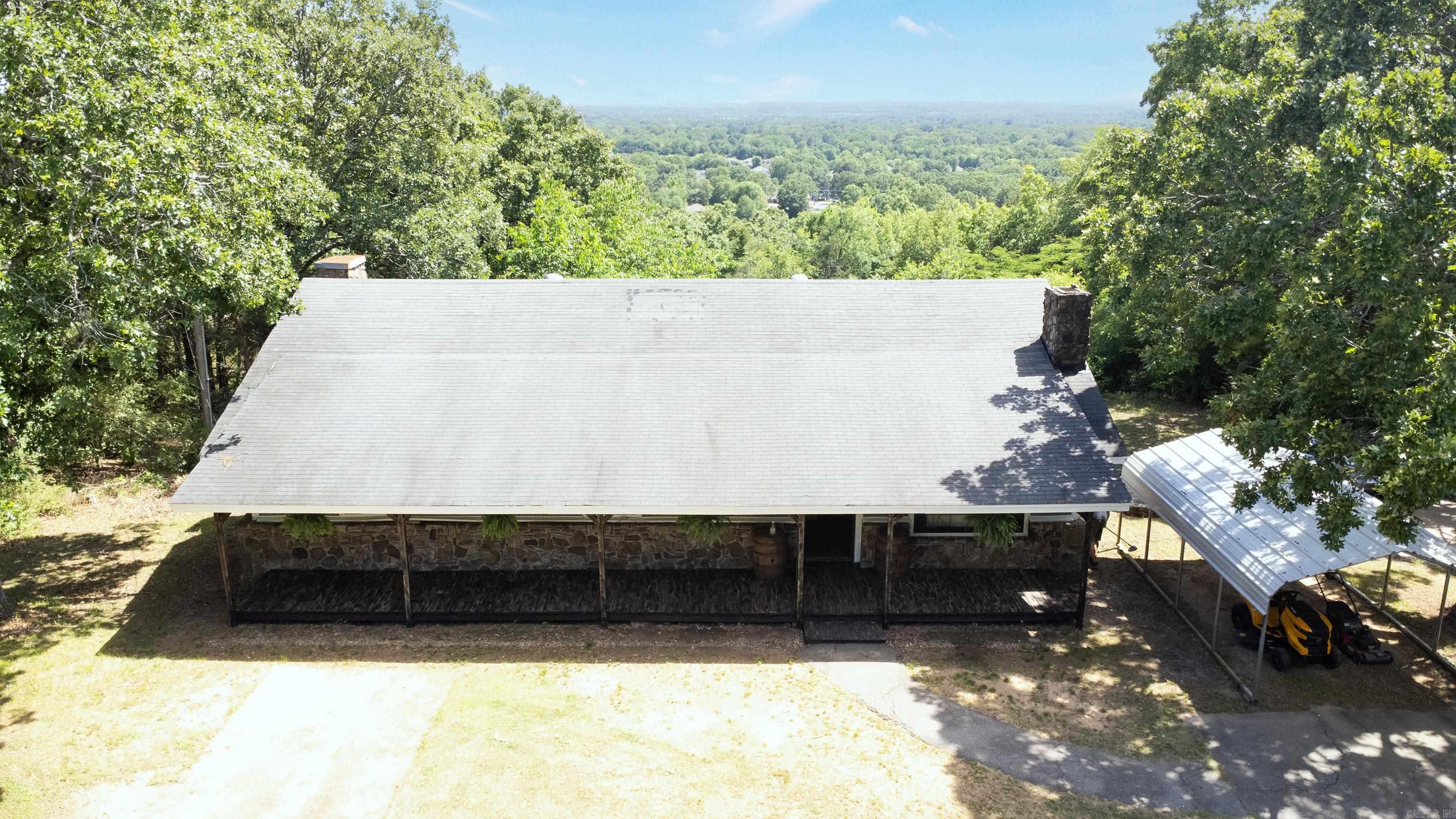 (Back on market due to buyer financing and no fault of the sellers.) No neighbors in sight and a view like this!!! WOW! If you are looking for your own slice of paradise, this is it! Nestled on 1.81 acres and located off the Old Morrilton Highway, but secluded as it gets! You are still within minutes of everything Conway has to offer but you feel tucked away. This 1,632sq ft home offers 3 bedrooms, 2 full baths, a shop, tornado shelter and a back porch with views that would make you think you are on Pinnacle Mountain! There's even an unfinished basement that could be converted to a separate living area with it's own walk access to outside! This property is just waiting for someone to put their personal touches on it and live their best country life! Schedule your showing today! AGENTS SEE REMARKS