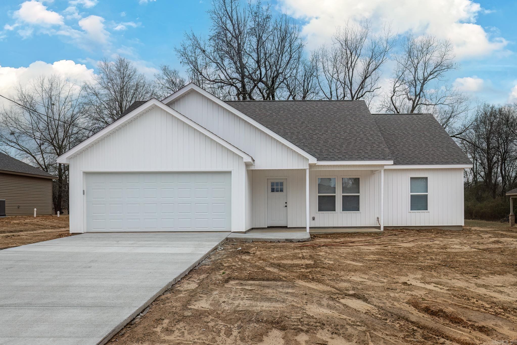 This stunning new construction home offers three bedrooms and two baths on a spacious lot, providing plenty of room to enjoy both indoor and outdoor living. The open-concept kitchen and living area features a large island and abundant built-ins, creating a perfect space for entertaining and everyday convenience. Beautiful stainless steel appliances complement the modern design, while luxury vinyl flooring adds both style and durability. The master suite boasts a huge walk-in shower and massive walk-in closet, with automatic lighting adding a touch of luxury and ease. A two-car garage provides ample parking and storage, and the seller is in the process of laying all-new sod to complete the exterior. This thoughtfully designed home blends comfort and functionality, making it a must-see.