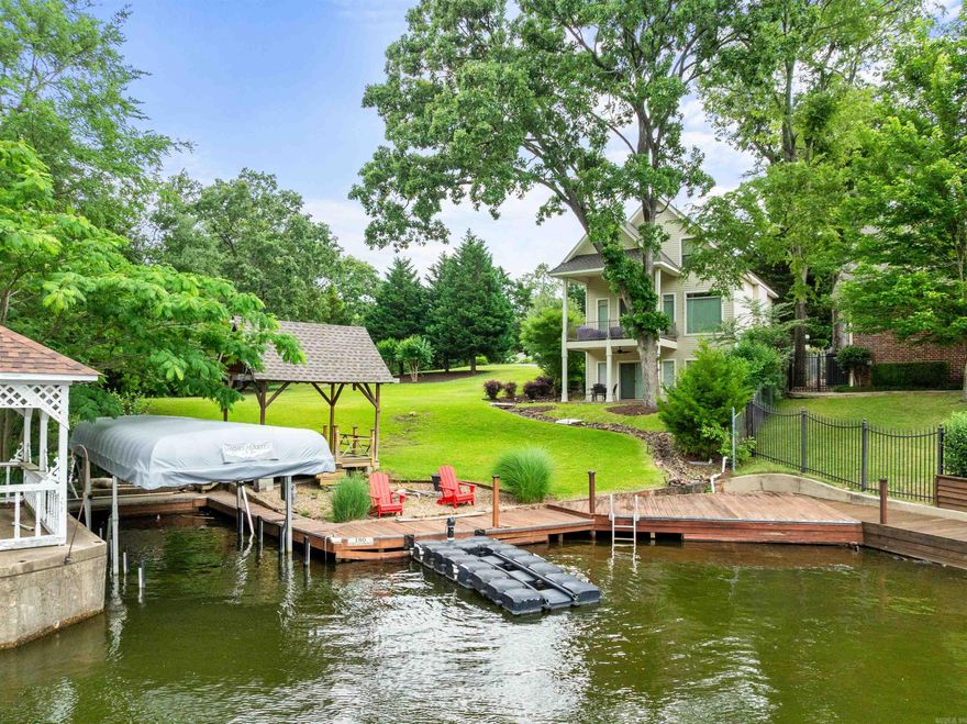Experience the perfect blend of lakeside relaxation and modern comfort in this beautifully updated 3-bedroom, 3.5-bath home on thecoveted shores of Lake Hamilton. Designed for both everyday living and weekend escapes, this charming property features a single-stallboat dock, making water access effortless for boating and fishing enthusiasts. The interior has been thoughtfully renovated with freshfinishes, updated flooring, and a bright, open layout that welcomes natural light. A spacious two-car garage adds convenience, whilemultiple outdoor living areas create the ideal setting for entertaining or enjoying peaceful evenings with panoramic lake views. Set on agenerous lot with lush green space, thereās ample room to expand the existing home or even add a second dwellingāoffering incrediblepotential for long-term investment or multi-generational living. Whether youāre looking for a serene primary residence or the ultimateweekend retreat, this Lake Hamilton gem is ready to welcome you home.