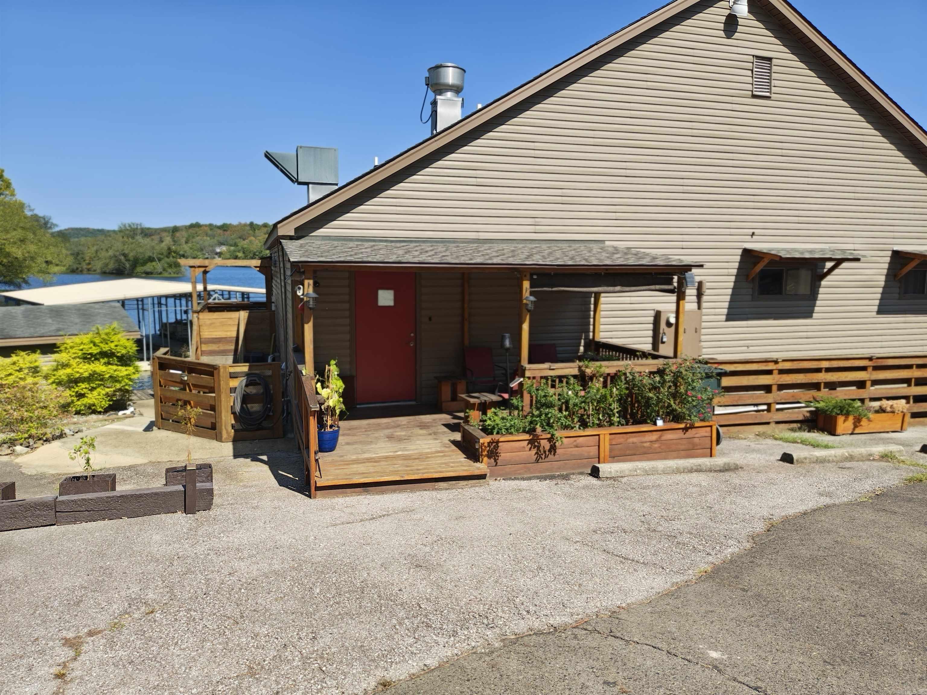 This completely furnished beautiful month to month long term rental sits on a level lake lot on Lake Catherine in the serene Diamondhead Community. The home comes with 2 parking spaces and 1 boat slip. When the long term, month to month lease is terminated, it will then be put on nightly rental. No pets allowed, 10:00 p.m. quiet time, cedar lined closets, new TV, electric fireplace, all utilities paid except for wi-fi, washer & dryer, refrigerator, loft upstairs that could be used for an extra bedroom or office. The community amenities include golfing on the 18-hole PGA golf course, fishing, boating, swimming in the Olympic sized pool, club house with restaurant, children's playground, tennis, basketball & pickle ball courts, and picnic area. You will enjoy entertaining on the large outdoor deck overlooking the lake.