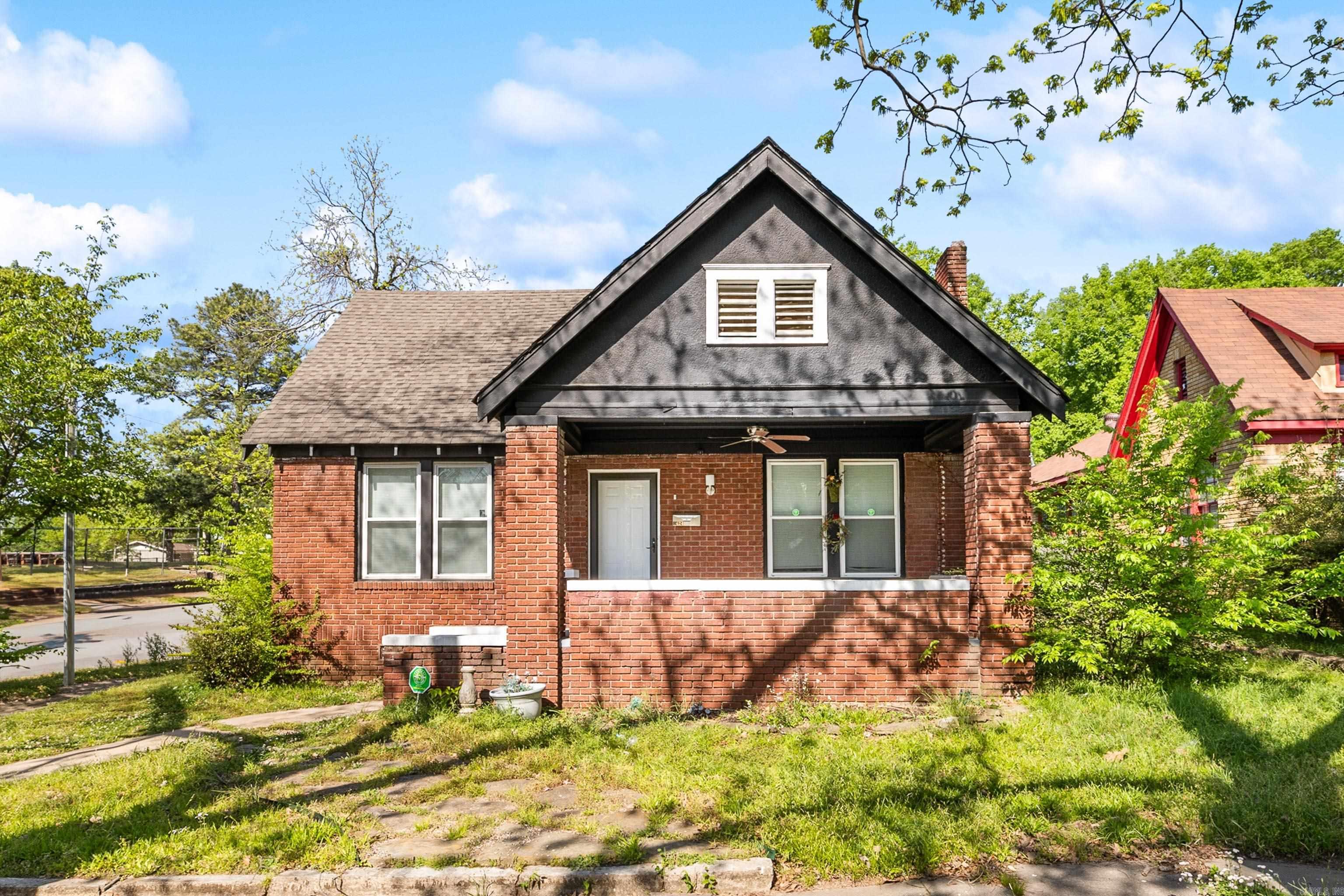 Charming updates meet classic character in this all-brick bungalow on a spacious corner lot! This 3-bed, 1-bath home is full of natural light and boasts fresh, modern finishes throughout. Inside, you'll love the updated flooring, neutral paint, and stylish black-and-white kitchen complete with granite countertops, stainless steel appliances, and a herringbone tile backsplash. The open living room features a cozy fireplace and large windows that bring warmth to the space. The bathrooms have been refreshed with contemporary fixtures and clean design. ATTENTION BUYERS! This home qualifies for a special financing program through Regions Bank that can make homeownership a reality with $0 Down Payment! All you need are your belongings, and this house can be yours. LIVE here for less than you are paying in rent!