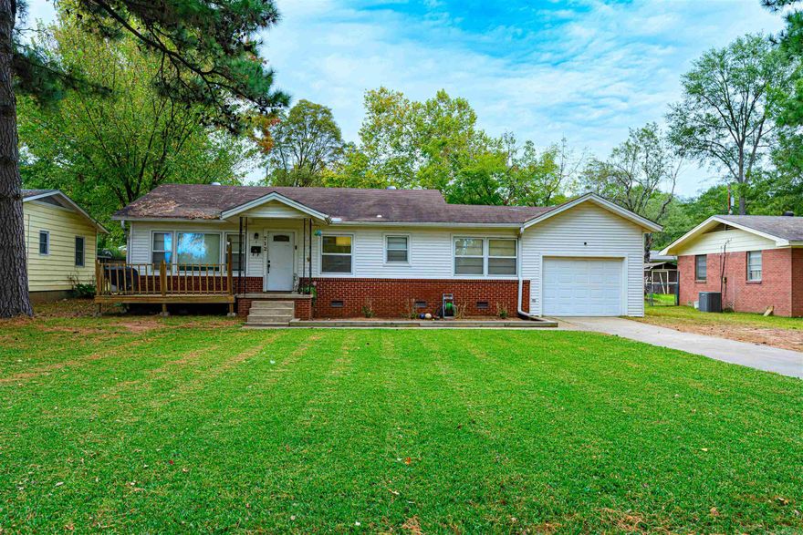 Adorable updated 2 bedroom, 1 bath home with 1 car garage. This home will make a great starter home or investment property.  New flooring, AC unit new in 2022. Spacious laundry/utility room could also serve as a small office. Fully fenced, large backyard perfect for kids to play or pets. Covered patio and the shed in the backyard has power. Refrigerator stays. Home being sold AS IS.