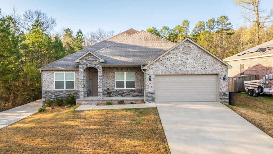 Charming 4-Bedroom Home on Private Lot with Extra Parking! Nestled at the end of a private street in a secluded subdivision, this well-maintained all-brick home offers privacy and convenience with green space on two sides and an extra 115’ driveway/RV parking pad. The stacked rock arched entrance welcomes you to a covered front porch, while the 2-car garage features a slip-resistant floor. Inside, enjoy an open and functional layout with wide plank laminate flooring, a spacious kitchen with black Frigidaire appliances, a pantry, and a new garbage disposal, plus a bright living room with recessed lighting and backyard access. The primary suite includes new carpet, a huge walk-in closet, and a garden tub/shower combo in the en-suite bath. Three additional bedrooms also feature new carpet, deep closets, and 2” wood faux blinds. The backyard is perfect for relaxing and entertaining, featuring a covered patio, an extended concrete patio with a sidewalk leading to the walk-thru gate, and additional Driveway/Parking Pad. With a low-maintenance exterior, gutters, and beautiful landscaping, this home is move-in ready! Schedule your showing today!