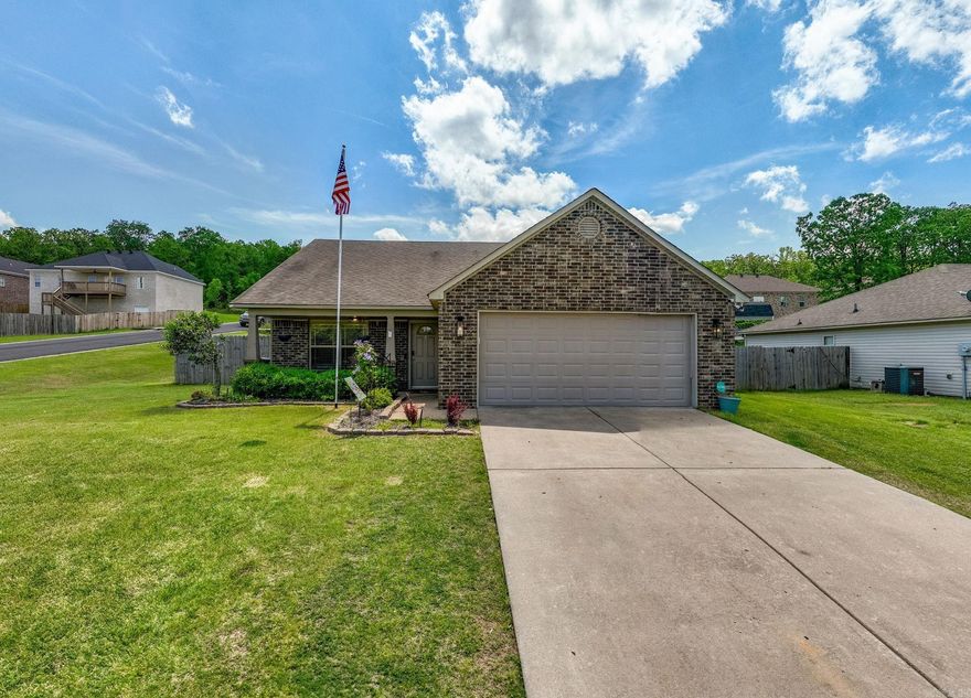 Welcome to this charming one-owner home, built in 2012 and situated on a spacious corner lot with a large backyard perfect for outdoor living. This 3-bedroom, 2-bath home features an inviting open floor plan that’s ideal for both everyday living and entertaining. You'll love the upgraded light fixtures that add a modern touch throughout the home. Relax on the sweet front porch or enjoy the covered back patio overlooking the generous yard—great for gatherings or quiet evenings. Don’t miss this well-maintained gem that combines comfort, style, and functionality in a fantastic location!