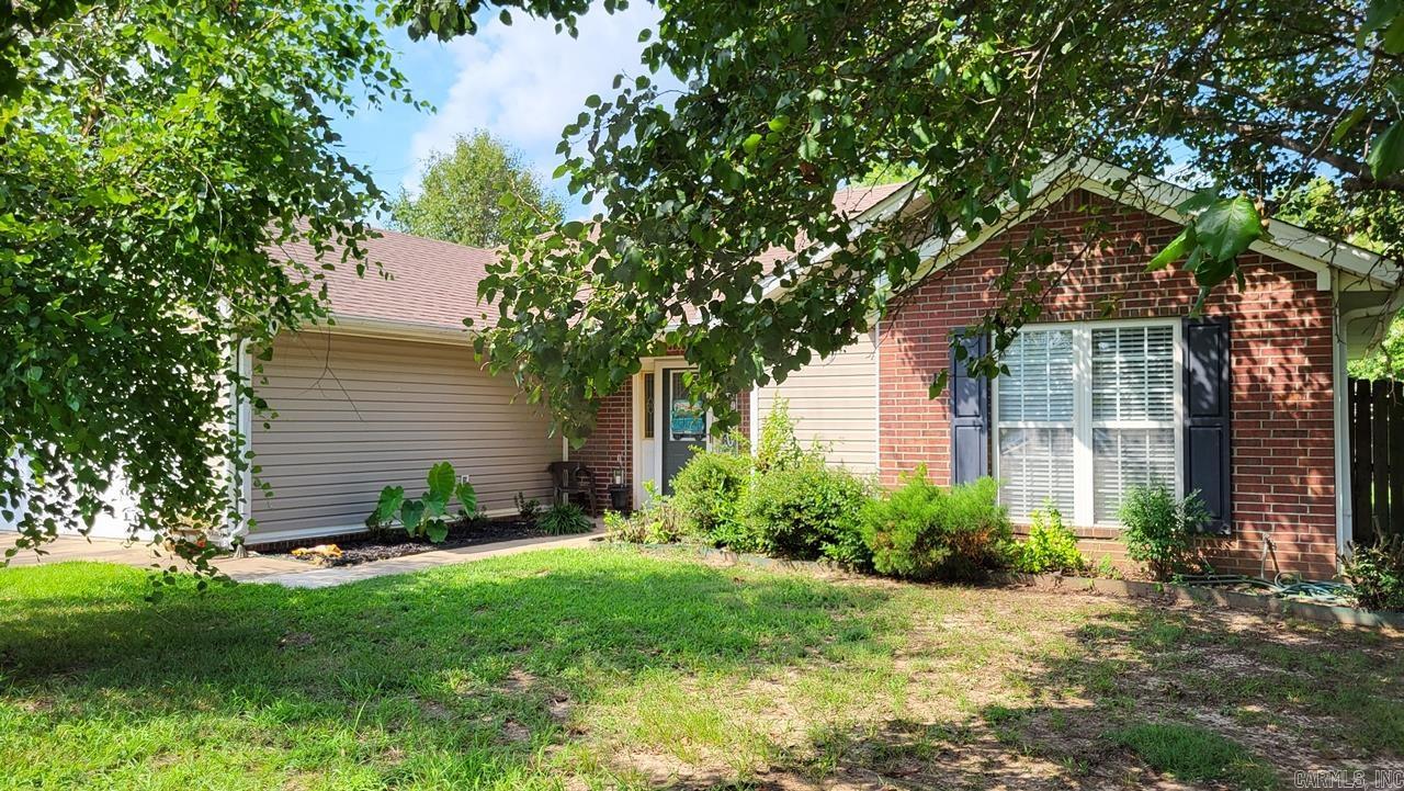 Great home with a great lay-out! Large primary suite with a big walk-in closet, dual vanity, and separate bath & shower. One of the spare bedrooms features a second walk-in closet! Split bedroom floor plan with a second hall bath. The great room has a vaulted ceiling, beautiful wood floors, and a gas fireplace as it's centerpiece. The eat-in kitchen features a breakfast bar, pantry, and plenty of cabinets.  There is a second dining area just off the breakfast room that is open to the great room. Roof installed in 2017 and new HVAC in 2022. Outside is a nice sized yard surrounded by a wood privacy fence, with a patio for outdoor entertaining and plenty of room for friends and family, or for children to play, or a pet to enjoy. Call about this one today before it's gone!