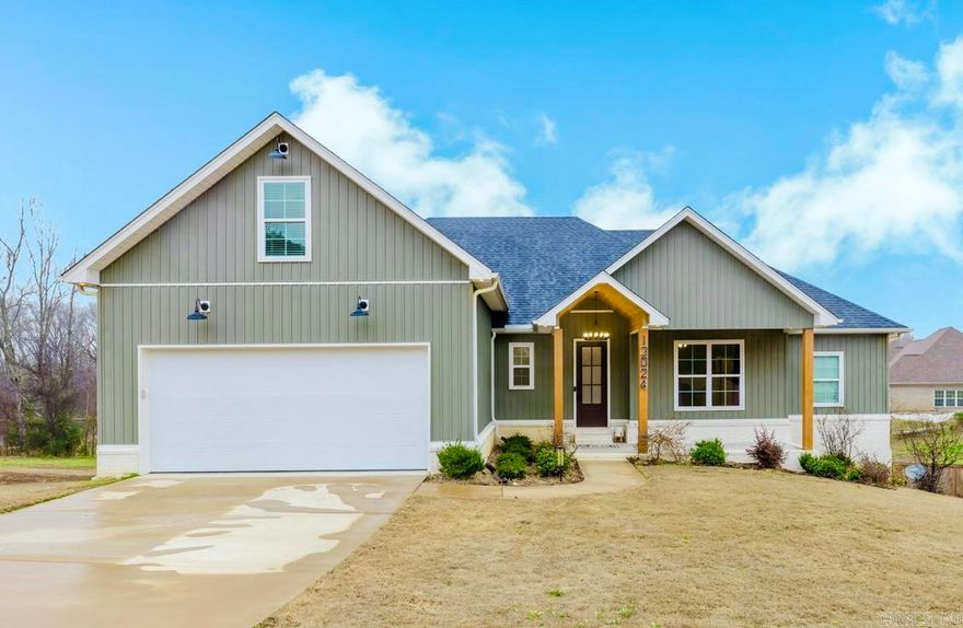 Built in 2023, this nearly new 4-bedroom, 2.5-bath home offers 2,632 sq ft on a spacious 0.95-acre lot, nestled on a quiet cul-de-sac outside city limits. Enjoy peaceful views of a neighboring pond and the privacy of a fully fenced backyard. This Avilla home features quartz countertops, custom built-ins, floating kitchen shelves, and a cozy wood-burning fireplace. The primary suite boasts an extraordinary walk-in closet with direct access to the laundry room for everyday convenience. A large upstairs bonus room with a half bath provides flexible living space for a media room, office, or guest area. Additional highlights include a covered back porch, abundant storage throughout, and open storage beneath the home. A thoughtfully designed property offering space, comfort, and modern style in a serene setting.