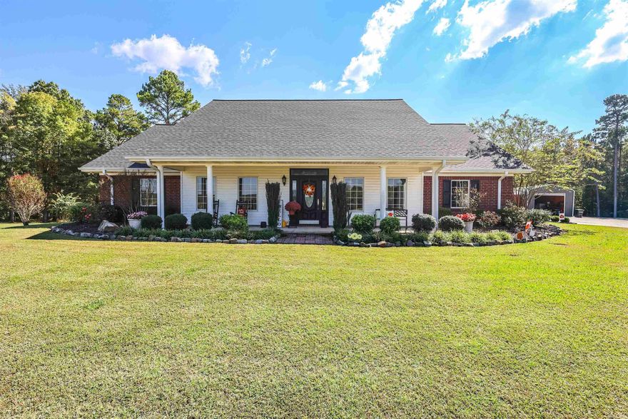 Discover country living at its finest with this stunning 2,798 sq ft home, nestled on 11.25± acres of peaceful countryside. Built in 2006, this beautifully maintained property offers 3 bedrooms and 3 bathrooms, including a spacious primary suite with a large walk-in closet and private bath. The home features a chef’s kitchen with a gas stove, double wall oven, pantry, and separate dining area—perfect for entertaining. Cozy up by the gas fireplace or enjoy summer days in the inground saltwater pool.  Additional highlights include a laundry room, foyer with coat closet, whole-house generator, and a 2-car carport with a spiral staircase leading to a bonus room. The property is complete with a paved driveway, newer roof (3 years old), and a brand-new HVAC system installed in 2025.  Outside, enjoy an impressive setup: a 30x40 equipment shed with 24x40 lean-tos on each side, a 24x30 insulated garage converted to a man cave with heat, A/C, sink, and fridge, and an 18x50 insulated workshop with electricity. An outdoor kitchen adds the finishing touch to this exceptional rural retreat.