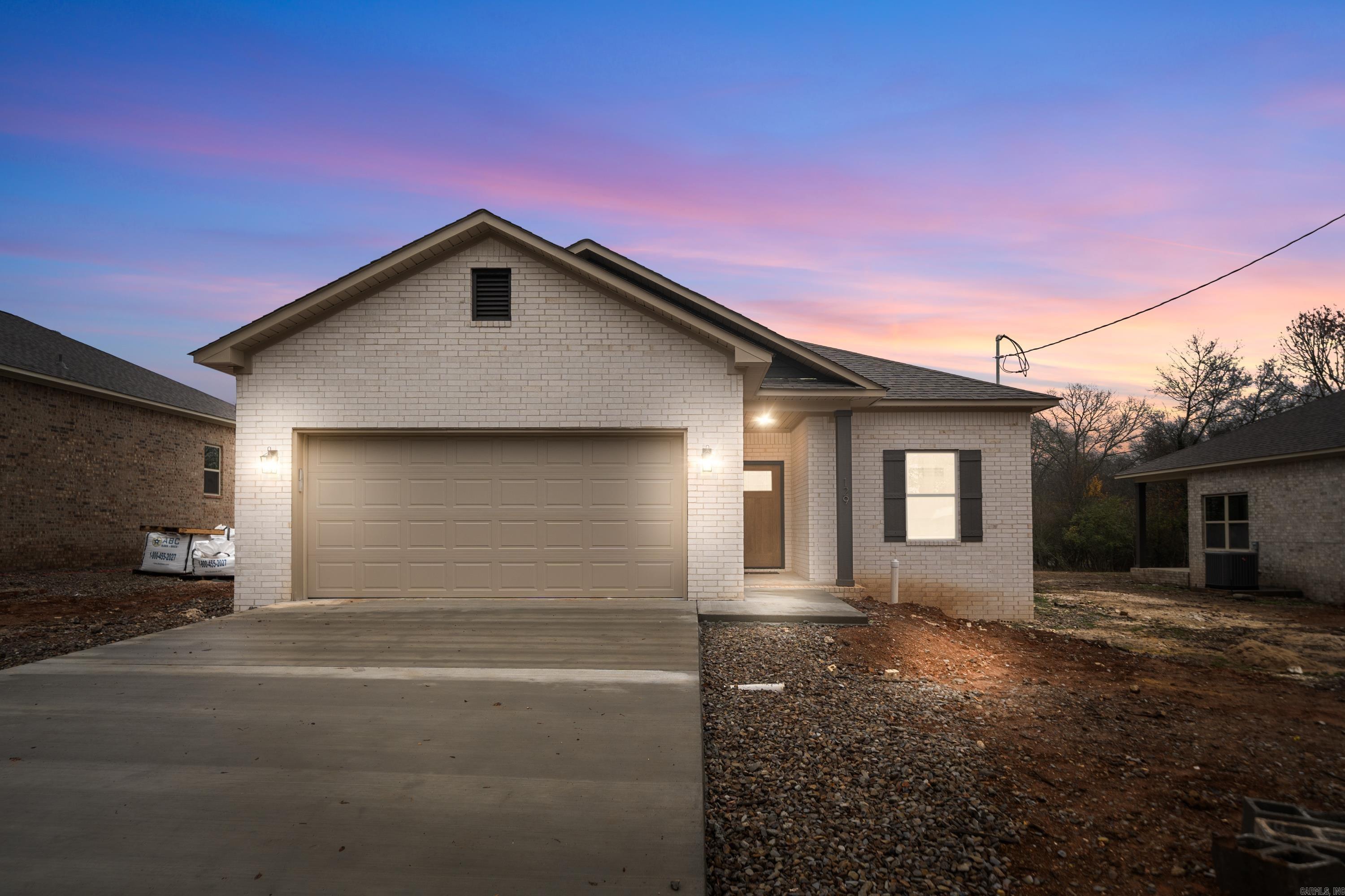 This absolutely stunning custom-built, new construction home is exquisite and is a true masterpiece. This 3-bedroom, 2-bathroom all electric, including the water heater and central heat, home is designed for modern living with top-of-the-line features throughout. From the moment you step inside, you’ll be impressed by the open layout, high ceilings, and premium finishes. The home features beautiful luxury vinyl plank flooring by Shaw, granite/quartz countertops in the kitchen/bath, and durable architectural shingles. The exterior is crafted with elegant brick with vinyl soffit & metal aluminum fascia, complemented by a high-quality fiberglass front door. Inside, you’ll enjoy 9-foot ceilings, and the primary suite includes a walk in shower. Every detail has been carefully considered, including insulated doors and walls for energy efficiency. Additional standout features include a sprinkler system on its own meter, a 2-car garage with insulated walls & doors, gutters, a covered back patio, and a fantastic location offering easy access to all that Hot Springs has to offer. This home is perfect for those seeking luxury, comfort, and style.Don’t miss the opportunity to make it yours!