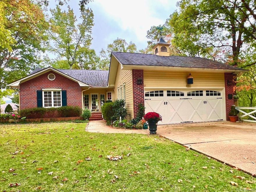 Beautiful Lake DeSoto home. This one of a kind, custom home sits on a 1/2 acre lot with a LEVEL driveway and a gentle slope to the lake. The New England style home welcomes you with a beautifully landscaped yard and charming glass door entry. There are multiple outdoor spaces to enjoy and many large windows for you to see the view when inside. The main level features a large living room with vaulted wood ceiling, a curved wall of windows. and a wood burning fireplace. There is an updated kitchen with an island, wall oven, ample cabinets, and a two drawer dishwasher. The dining area features a sliding glass door to the deck and leads into a welcoming den. The laundry room leads to a two car garage with golf cart storage. The master bedroom has a vaulted wood ceiling, access to the back deck, and a beautiful bath with a walk-in shower. Completing this level is a guest bedroom and bath. Downstairs has a full bath, two bedrooms (one with its own half bath), a lovely screened in porch, game room, and a large flex room suitable for many purposes. A large cedar closet, shop, and covered patio round out this lovely home. Some furnishings are available. Agents, read confidential remarks.