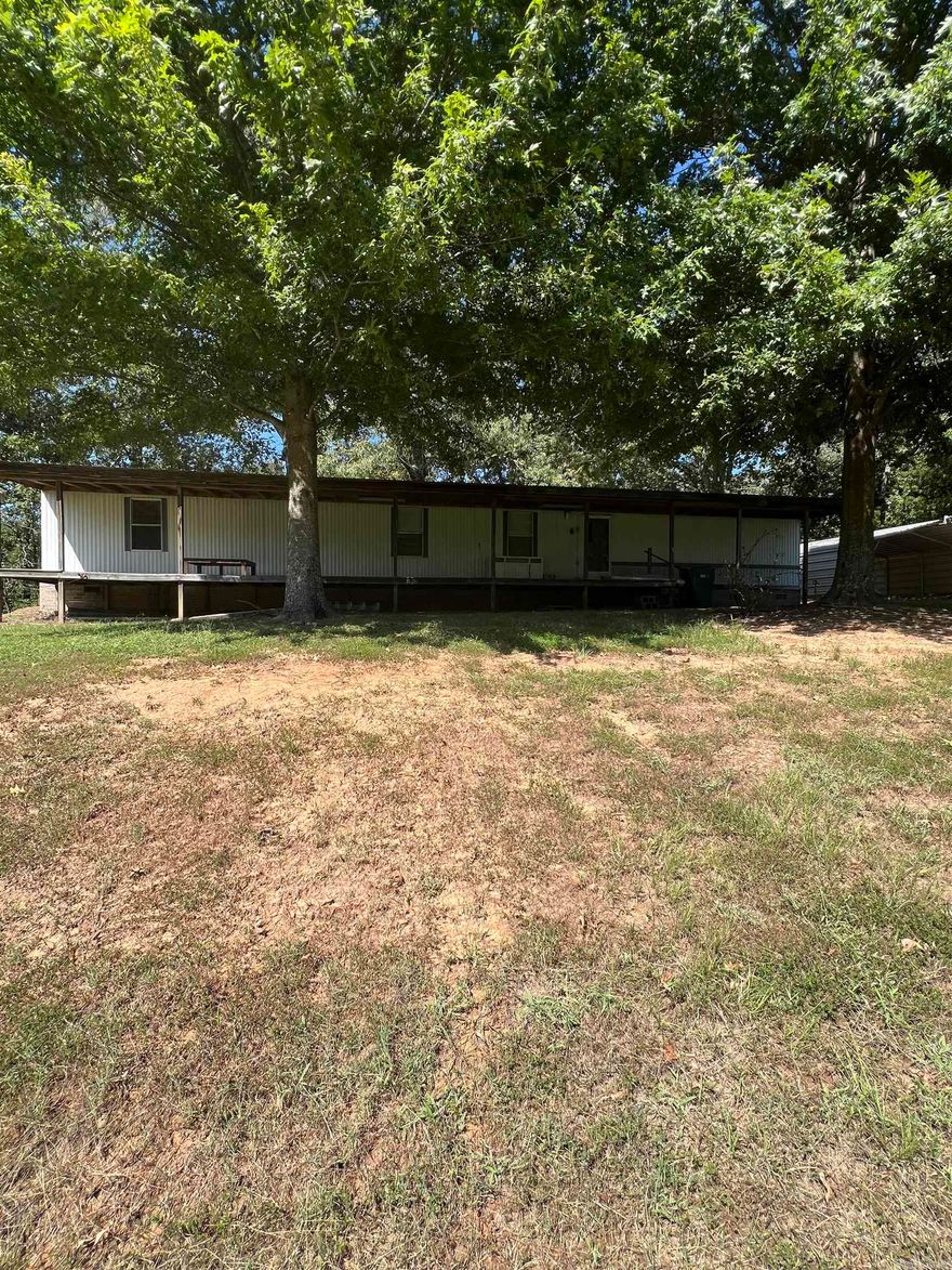 Enjoy peaceful country living on approximately 1 acre with this updated mobile home. Featuring fresh paint, New LVP flooring, this home is move in ready. Also enjoy the front covered front porch with over 400 sq ft to enjoy. Plenty room for parking with a carport and two storage buildings.