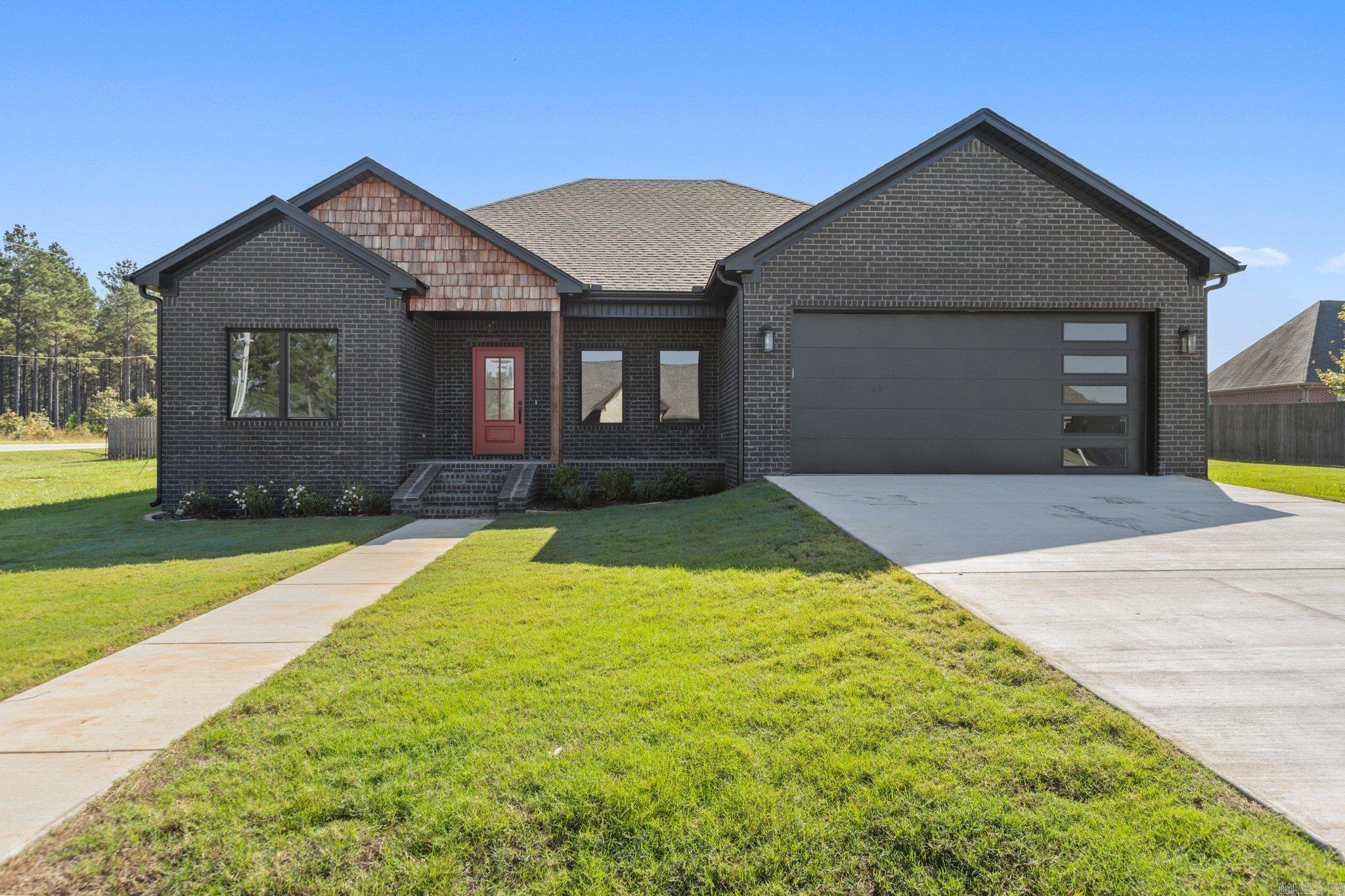 New Construction home in the beautiful Westbrooke Subdivision! This all brick home sits on a large corner lot and features 4 bedrooms, 2 bathrooms and an open/split floor plan. Luxury vinyl plank flooring throughout the home! Stainless Steel appliances in the kitchen as well as a pantry and granite counter tops! Home also features a spacious primary bedroom, walk-in closet with built-ins, his and her vanities in the primary bath, walk-in tile shower and soaking tub!! Sheridan School District! Don't miss this one!!! Schedule your showing today!!