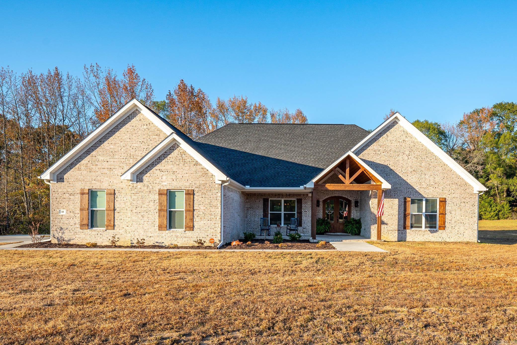 Beautiful, spacious 4 bed/3 bath home in Greenbrier on a one acre lot built in 2022! Wonderful covered front porch with stained wood ceiling. Open floor plan with large living room, dining room, and kitchen. Living room features a gas fireplace with tons of natural light. Kitchen is a chefās dream with gas stove, custom cabinets, granite countertops, black stainless steel appliances, and a huge center island with storage on both sides. There is a separate walk-in oversized pantry. Large primary bedroom suite with tons of storage, built-ins, large walk-in closet, separate sinks/vanities with granite countertops, beautiful, walk-in tiled shower, and wonderful soaker tub. Access to the laundry room from the primary bath or mudroom/garage entry area. One guest room has an en suite bath and the other two guest rooms share a nice sized hall bath. New blinds. Home security system, e-thermostat and luxury vinyl flooring throughout. The spacious backyard has a great covered patio with a stained wood ceiling and attached deck. Beautiful front landscaping.