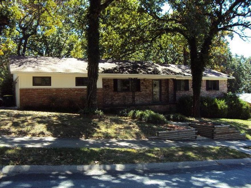 Everyone take another look (many upgrades) New carpet, New paint, Beautiful hardwood floors.  Home features 2 living areas, 3 bedrooms on main level, downstairs could be 2 bedrooms (great place for kids) formal living room, den off kitchen, large dining area for family dinners. Large fenced back yard, side loading garage, roof has been replaced. Seller will pay cc with excepted offer.