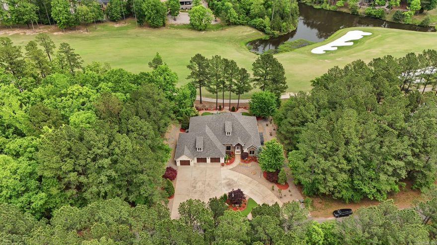 Meticulously maintained, custom-built masterpiece nestled on highly desired Granada 15 fairway. 3BR/3.5BA home showcases quality craftsmanship, upscale finishes, & unparalleled privacy. Adjacent wooded lot included. Open-concept layout, 12-ft ceilings, crown molding, & large office. Great Room with stone-tiled ventless gas fireplace, custom built-ins, & floor-to-ceiling views fairway. Gourmet kitchen features custom cabinetry, granite counters, stone backsplash, stainless appliances; induction cooktop, oven, convection/microwave wall units, trash compactor, wine cooler, 2-drawer dishwasher, refrigerator with ice/water & extra-large breakfast bar. Spacious Master Suite offers a private sanctuary. Spa-like bath features a jetted Jacuzzi tub, walk-in shower & expansive his and her closets. Two guest suites feature private en-suite baths & walk-in closets.  Oversized 3-car garage with storage, shop provides the ultimate year-round project space, full staircase leads to a floored attic for effortless storage. $75,000 landscaping upgrades, lush greenery, mature trees, & decorative boulders. Extra-large circular driveway. East facing covered back porch.