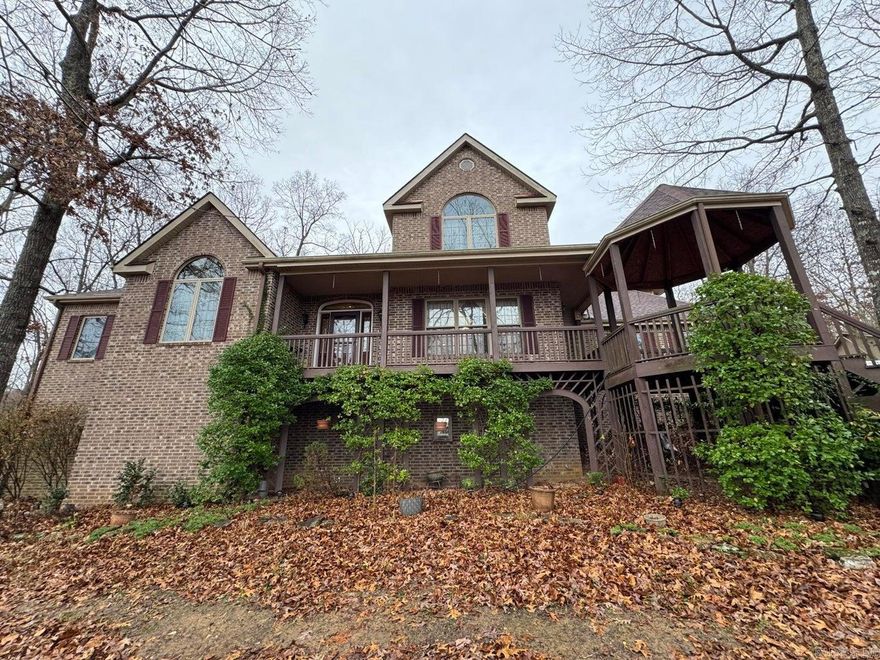 Discover privacy and craftsmanship in this well-built, three-story brick home set on 86.5 ac overlooking a beautiful 5-acre pond. With a walk-out basement, 3-car garage, and a large shop for storage, this property is ideal for those seeking both comfort and functionality in a secluded setting. The main level features a cook's kitchen with large pantry, dining room, vaulted living room, formal living room, laundry, and a spacious primary suite. The third floor offers three bedrooms and a full bath. The finished walk-out basement provides a full second living area with kitchen, dining, laundry, game room, living room, additional bedrooms, and full bath—ideal for guests or multigenerational living..A rare combination of privacy, space,and quality construction in a stunning natural setting.