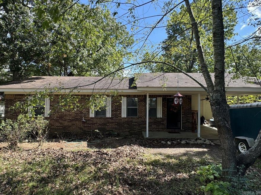 Super cozy 3 bed 1 bath brick home located close to town to enjoy all the amenities but still has no restrictions. Large lot has area fenced for your fur babies and a storage building along with a chicken coop or a goat home.