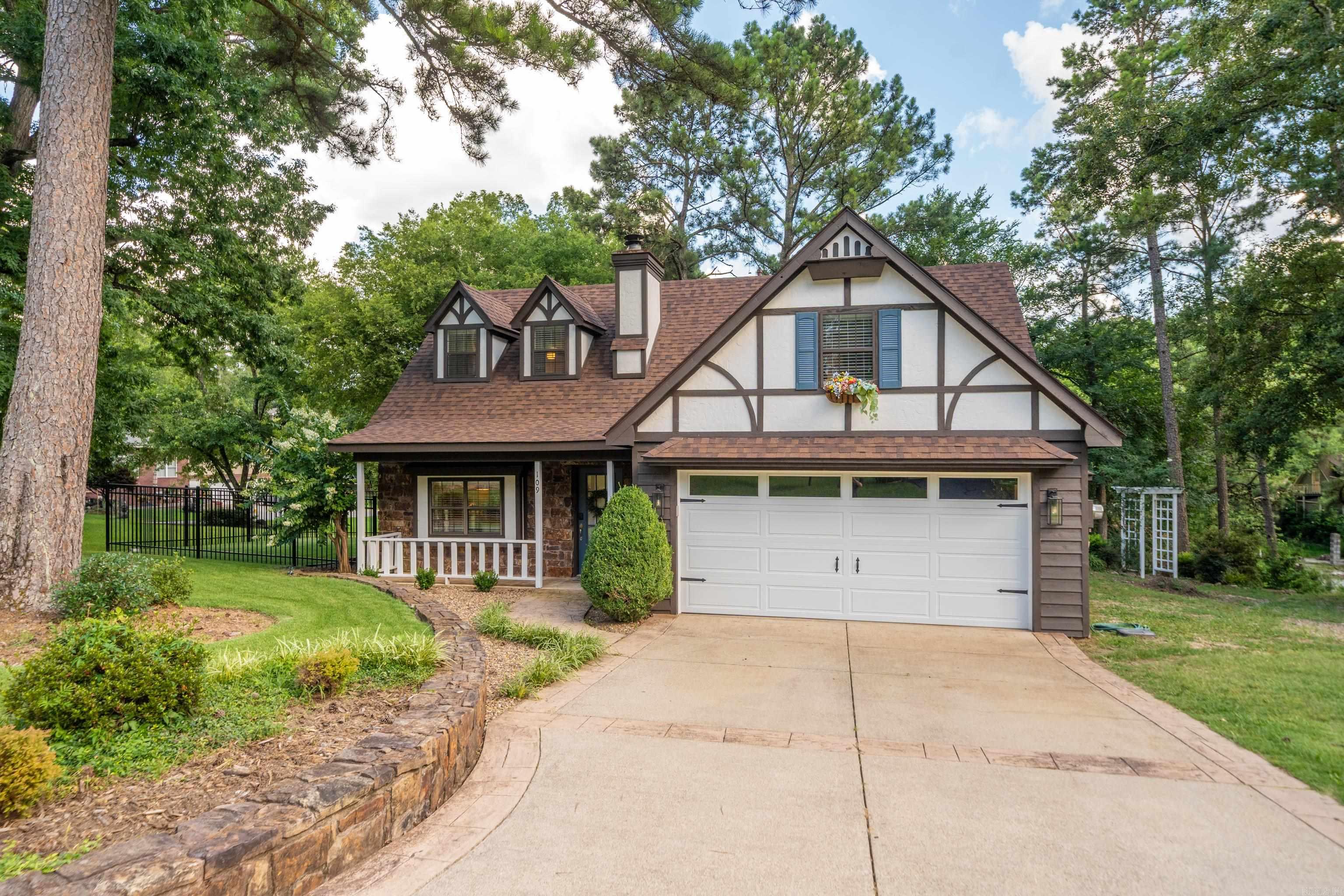 Welcome to this exquisite property, where timeless elegance meets modern functionality. The main home boasts 1544 sq. ft. with 3 bedrooms 2 baths and Tudor-style exterior with stone accents, offering curb appeal and classic charm. Inside, youāll find luxurious finishes, including crown molding, beadboard ceilings, and planked ceilings, creating a warm and inviting atmosphere. Main Home Features: Gourmet Kitchen: Equipped with granite countertops, a pantry, and top-of-the-line appliancesāperfect for the home chef. Master Suite Includes a private sitting room/ office, adding versatility to your living space. Cozy Living Area: Centered around a wood-burning stone fireplace, ideal for gatherings or quiet evenings. Outdoor Oasis: Upper Deck (40ā x 14ā) for entertaining with scenic views. Stone steps lead to a single-boat dock, offering easy water access. Metal-fenced dog run (27 x 25) and a firepit area (18 x 14) on second-level deckāperfect for outdoor enjoyment. Detached ADU (Accessory Dwelling Unit): A 686 sq ft shopāideal for storage, hobbies, or a home business, includes half bath. Upper Level: A 364 sq ft apartment with mini kitchen and full bath. You must see this adorable home!