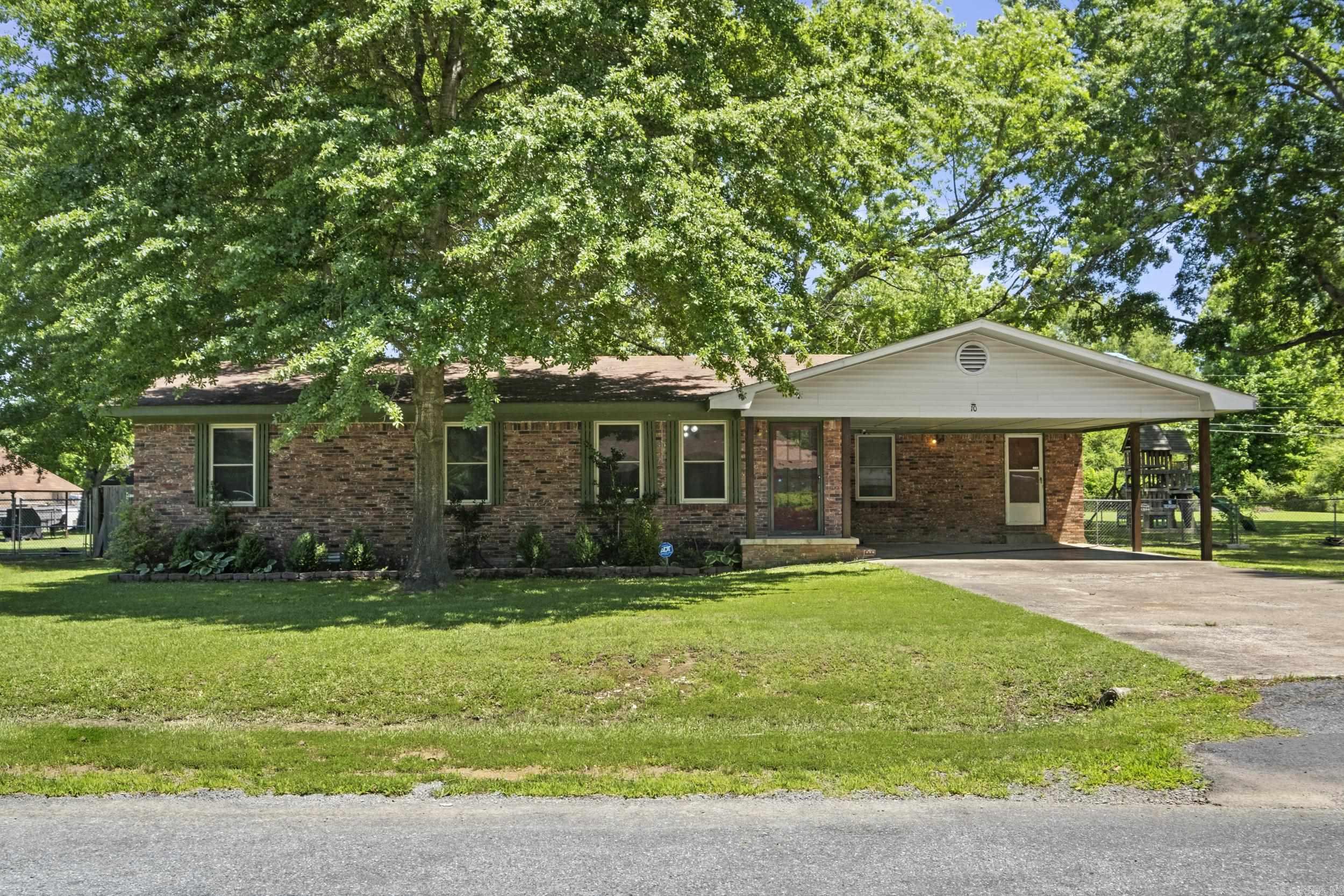 Here it is! An adorable Ranch style home featuring updated flooring and Neutral tones. 2 Open living areas Designed for Entertaining. Kitchen has Stainless steel appliances and perfect spot Coffee bar. Cozy den with a brick Fireplace and Wood mantel adds Warmth and character. Jacuzzi tub with tile surround. Large laundry room and Space for Pantry. Over 1/2 acre Fenced backyard with Double gates, Mature shade trees, and a screened-in Porch perfect for evenings. 20x24 Shop with electricity, Shed and Lean to for hobbies and Storage. Whether you’re hosting a cookout, Tinkering in the shop, or relaxing on the Porch, this Home offers space, Versatility, and comfort in a quiet, Convenient location near Shopping, dining, and Schools. HVAC Nov 2021, New roof coming soon, Water heater 2023. Don’t miss this one-of-a-kind property—schedule your private showing today and discover all the features you’ve been looking for!