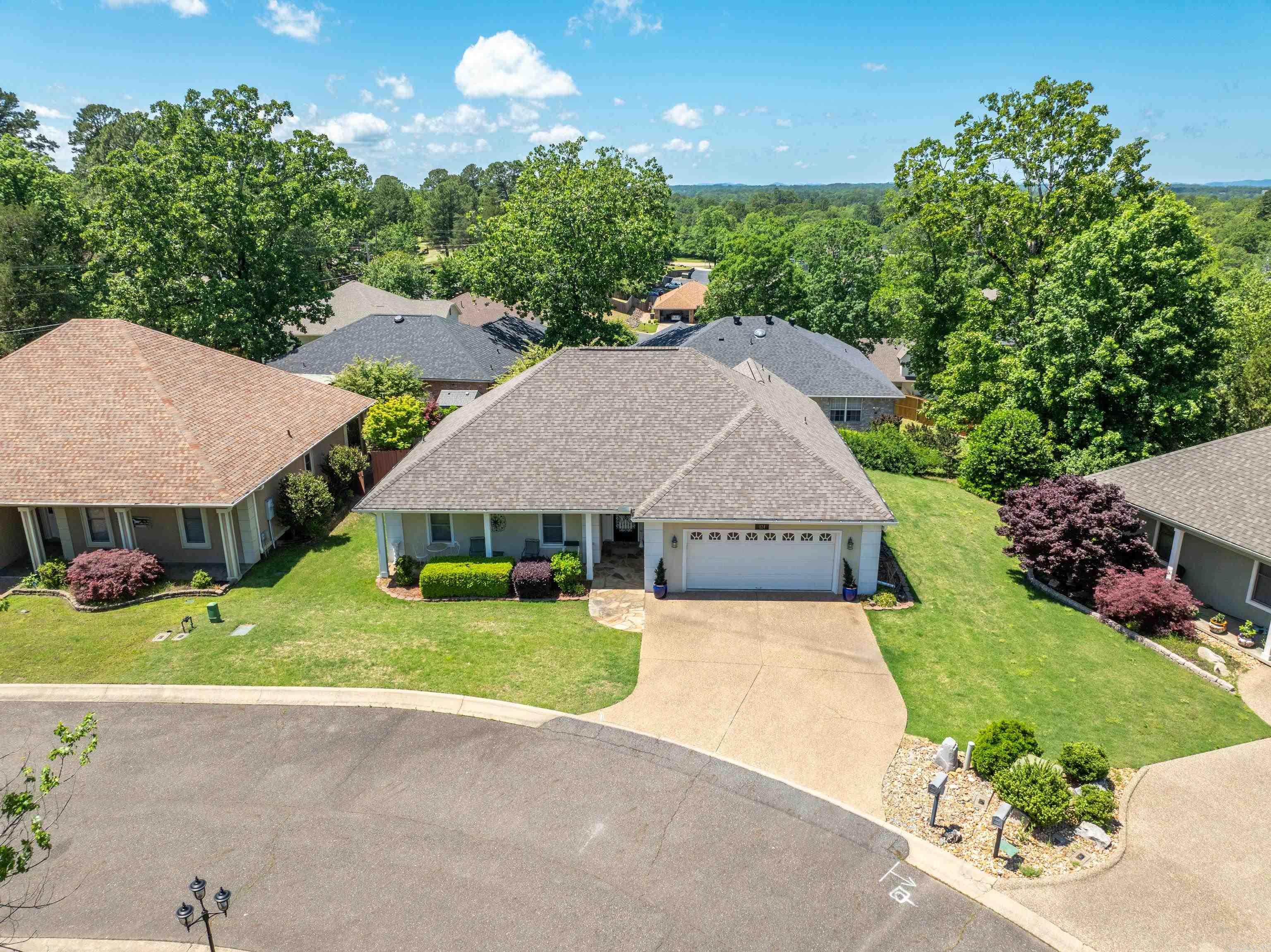 Discover the charm of 124 Garden View Circle! Tucked away in a quiet enclave of just seven homes, this beautifully maintained retreat offers the perfect blend of comfort, style, and privacy. Step inside to an inviting open split-bedroom floor plan—ideal for both entertaining and everyday living. The kitchen features marble countertops and sleek stainless steel appliances that make cooking a joy. The spacious primary suite is your personal sanctuary, complete with a luxurious ensuite bath, walk-in shower, jetted tub, double vanity, and generous walk-in closet. Unwind in the enclosed sun porch—your own peaceful haven perfect for morning coffee, evening wine, or hosting friends in every season. The beautifully landscaped yard adds to the home’s curb appeal, and with a full sprinkler system, maintaining a lush, green lawn is effortless. Don’t miss your chance to call this serene, sought-after neighborhood home. Seller is offering a $10,000 flooring allowance. Schedule your private tour today!