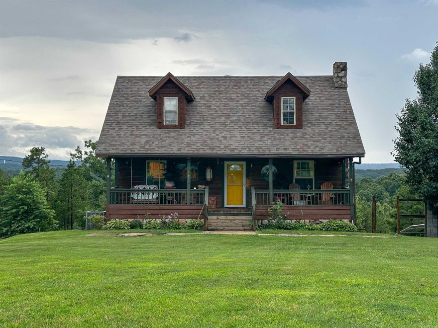 No 025039 Come see this beautiful 1914 sq ft cabin style home in Mountain View, AR with peaceful mountain views and plenty of space to enjoy. This 4 bedroom 2.5 bath home features two stories and a finished basement with hardwood floors throughout. Each level has a bathroom including a half bath in the basement with a toilet and sink. The basement also offers a laundry room and a separate sink vanity in the main area, ideal for guests or added living space. The main living room features a cozy gas log fireplace and warm wood finishes that bring out the cabin charm. Covered front and back porches offer the perfect spots to relax and unwind, with the back porch giving you a beautiful view of the mountains. Solar panels convey reducing power bills to less than $20.00 per month. A 14 x20 shed or workshop is included. Enjoy the concrete sidewalk for easy outdoor access. Whether full-time living or a weekend retreat, this home offers comfort, character, and scenic surroundings in the heart of the Ozarks. $249,000