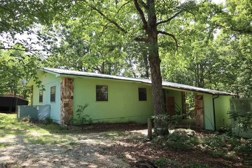 COUNTRY HOME & ACREAGE FOR SALE NEAR SALEM ARKANSAS  Property located at 123 Greenbrook Trl, Salem, AR. This 3 bedroom, 2 bath home has approx. 1,344 sq. ft. of living area.  It includes central H&A, range, refrigerator, dishwasher, microwave, washer, dryer and gas fireplace. It has a single carport, parking shed and 2 outbuildings. Also includes well, septic system and a propane tank. There is a concrete storm shelter just at the edge of the house. Large shaded yard, fruit trees and plenty of space for a garden and a few small animals. Great location just off of Hwy 9 S with approx. 1/8 mile of county gravel road. You can also sit on the back covered deck to enjoy the beauty that the Ozarks has to offer. Lake Norfork, Spring River & the world famous White River are within 30-45 minutes. The real estate taxes last year were around $450. Make your move to the Ozarks and enjoy all the features that this property has to offer.