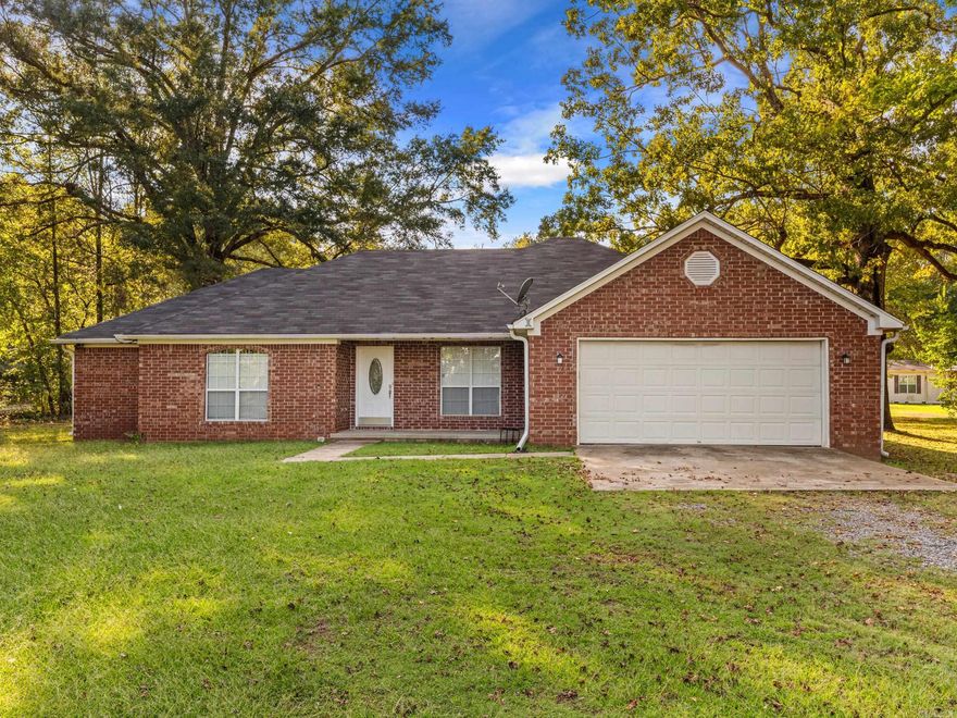 Welcome to this inviting 3 bedroom, 2 bath home nestled on a full acre just outside city limits. Inside, you’ll find a thoughtful floor plan with laminate flooring flowing through the kitchen and guest bedrooms, durable tile in all wet areas, and plush carpet in the private primary suite. The spacious primary bathroom is designed for comfort, featuring a double vanity, jetted soaking tub, walk-in shower, and an oversized closet. Also, BRAND NEW HVAC! Natural light fills the main living areas, creating a warm and welcoming atmosphere. Step outside to enjoy the large backyard, fully enclosed with a 6-foot wooden privacy fence—perfect for pets, play, or entertaining guests. With plenty of outdoor space, you’ll have room to garden, relax, or simply enjoy peaceful country living while still being close to town. This home combines comfort, convenience, and room to grow, offering the best of both worlds. Don’t miss the opportunity to make it yours—schedule your private showing today! Agents see remarks!