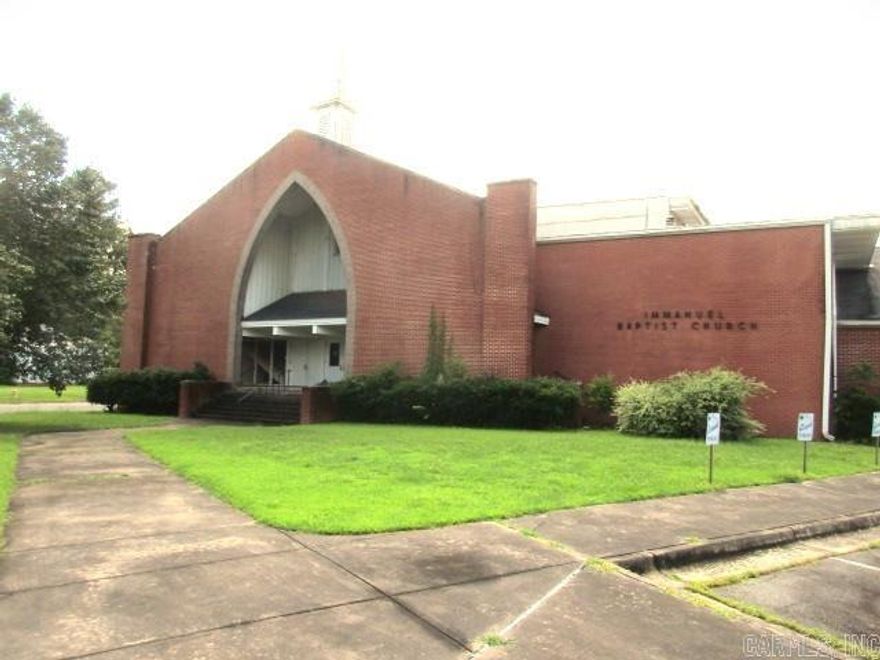 What a unique space for sale.  This church building has so much history.  This large building sits on approx. 4 acres.  It could be used for a place of worship as it has 2 sanctuaries.  A full gym, with a small stage area, commercial kitchen, dining area, offices, classrooms, nursery, bathrooms, library, choir room, 2 floors and so much more.  Smaller sanctuary and area is currently being rented weekly.  Large parking area on both sides of the church.   70,000sf, but measuring is encouraged.   Call today to see this property.