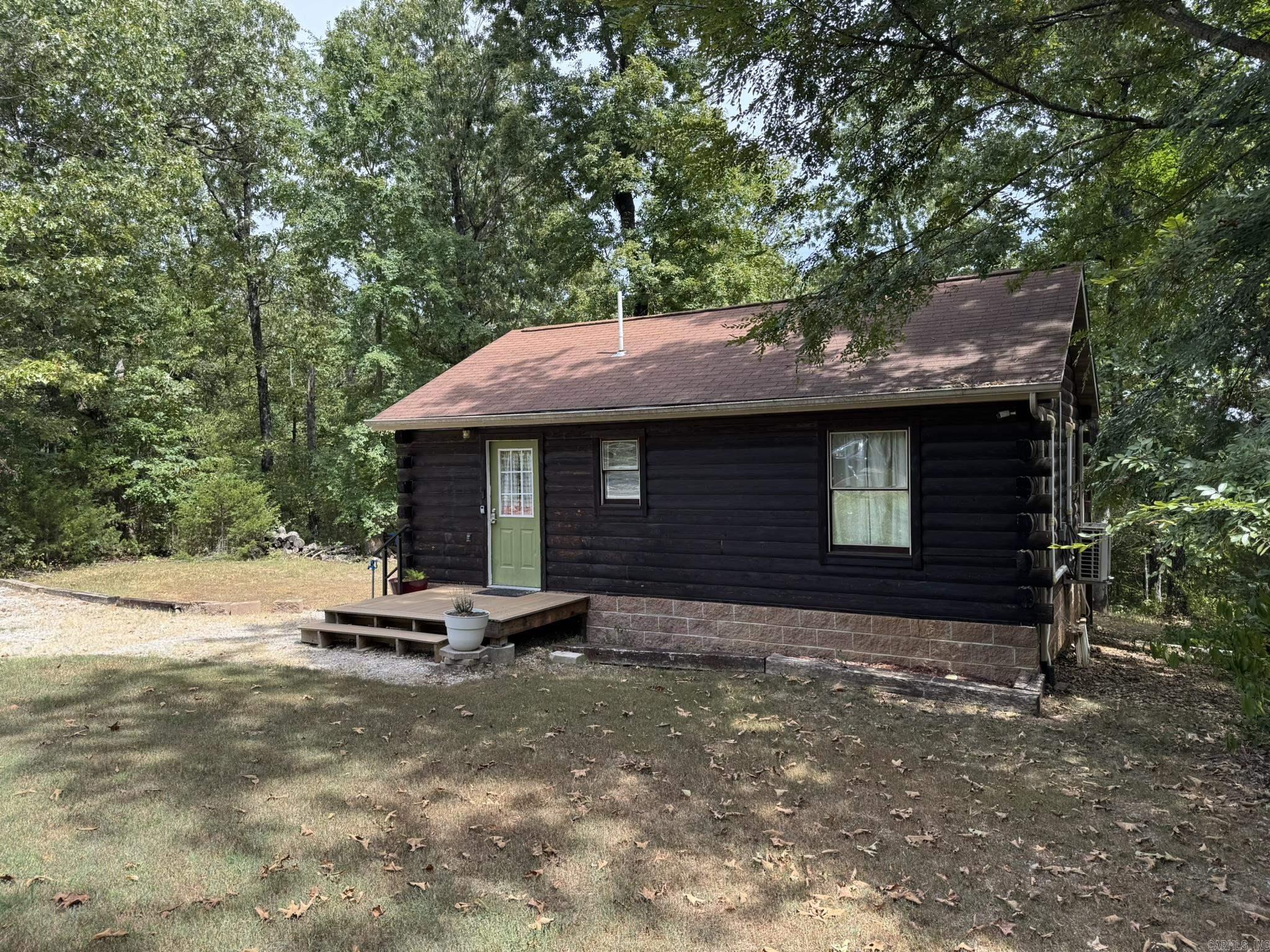 You will be amazed at the craftsmanship put into this recently updated Cabin located on a level 3.43 ac/ml wooded lot, not far from Lake Norfork Access. Inside you will find a well-designed open feel living space, with real wood features like the tongue & groove ceilings, & walls. Real wood cabinets in the kitchen, with modern appliances. The bathroom features a stackable washer & dryer, plus all the appliances & furniture can convey with an acceptable offer. Outside you will find a large deck & spacious fire pit area to enjoy while you soak up natureās beauty. The home sits back off the county road for your privacy. Come take a tour.