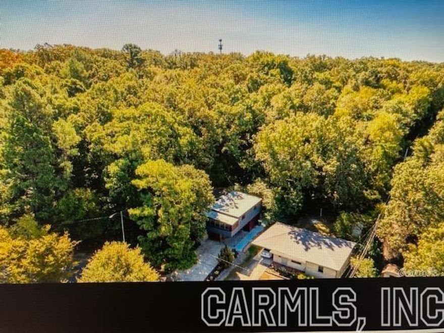 Check out this HIDDEN GEM on a LARGE lot, extra landscaping! Well taken care of Home.  Beautiful, refinished hardwood floors! LOTS of built-in storage. Cozy kitchen features gas stove, lots of cabinets space. Lots of natural light, open concept. Sunroom off Master could be workout room, craft room, bonus area. Upstairs bath remodeled 2020.  Bonus room down could be 3rd bedroom.  Launary room has a 1/2 bath, has tons of storage and multiple uses. This is an "As Is" Listing.  Free standing fireplace doesn't convey.