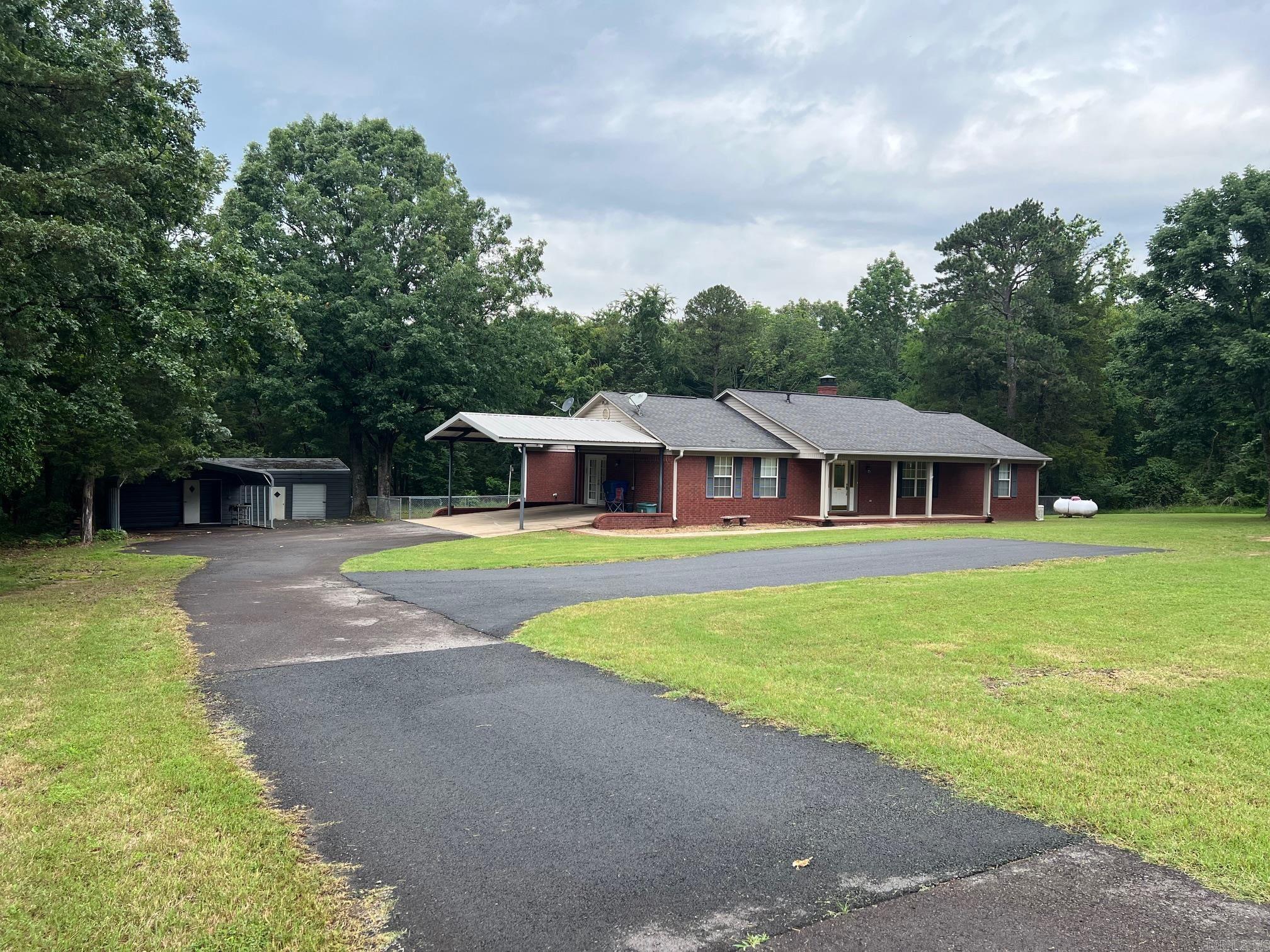 Well Maintained Brick Home. 3 Bedroom 2 Bath. Wood burning Fireplace. Fenced back yard. Two nice outside storage buildings with electric. Above Ground Pool Generac Backup Generator. Split Floor Plan, Granite Counter Tops, Seller is offering a flooring allowance or seller paid closing cost. Sits on 1.91 acres
