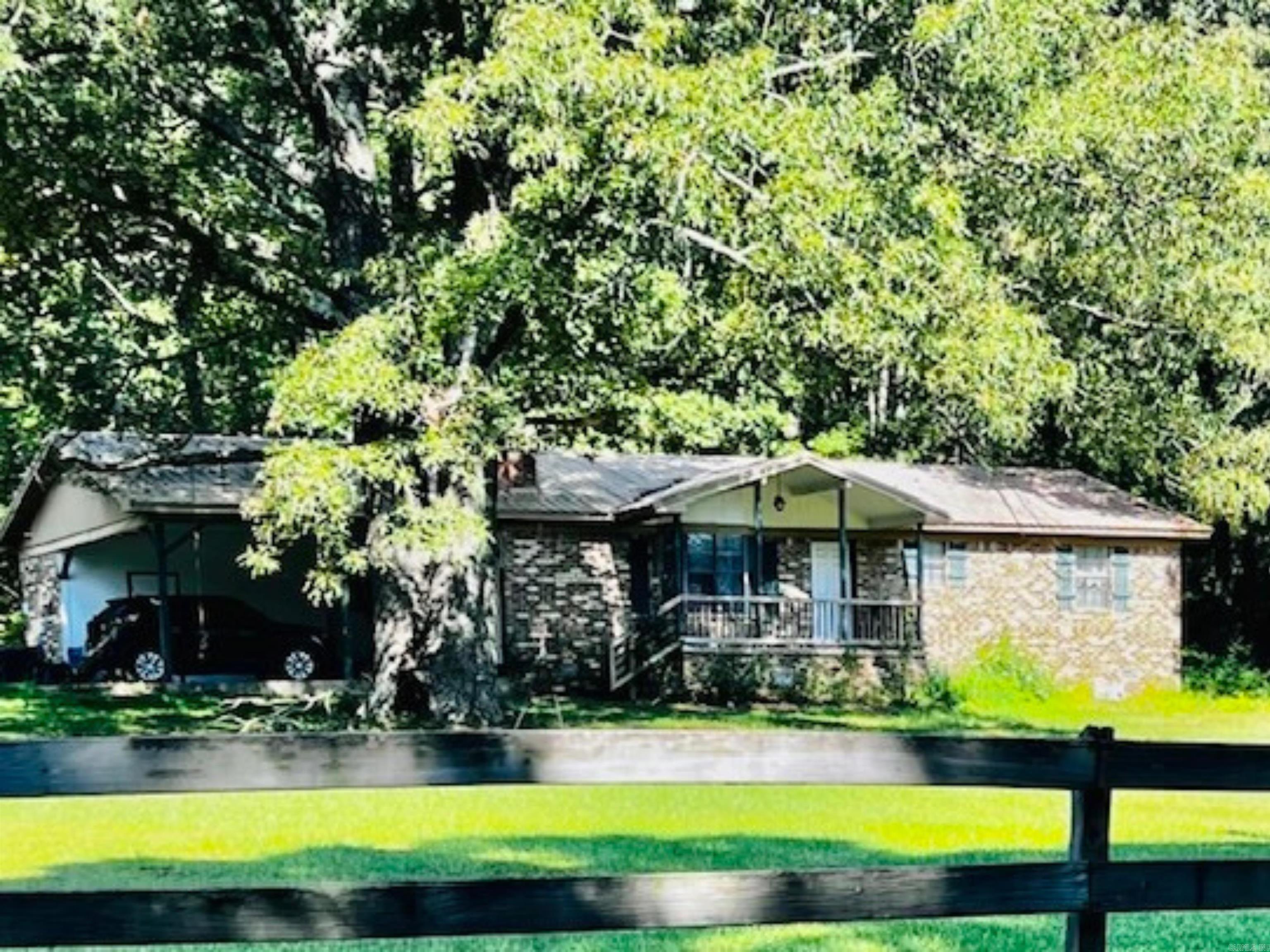 Nestled among some big trees is a 3 bdr 2 bth 1500 sq ft home that comes with 2 acres of roaming room! Plenty of space for kids to run and play. Wildlife at the back, watch the deer and the squirrels from your back window. Living & dining are open and flow nicely to draw your attention to the woodburning fireplace for those cold nights. Home is warm and welcoming. All hard surface flooring, roof is metal and around 8 years old, new water heater, the HVAC has been serviced seller not sure of the age. Call listing agent to see this little jewel.