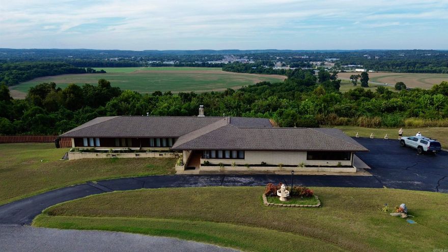 Perched on a mountaintop overlooking Batesville, this remarkable home combines privacy, charm, and breathtaking views.  Step inside to an open floor plan highlighted by an inviting fireplace and expansive windows that frame stunning scenes of mountain ridges, colorful sunrises and sunsets, and even the Milky Way or full moon glowing above the city lights below. Thoughtfully renovated with attention to architectural details, this residence balances modern comfort with timeless appeal.  Offering 3 spacious bedrooms, 2.5 baths, and a large 2-car garage with ample storage, the home provides both function and beauty. Every corner has been carefully updated, making it truly move-in ready. Whether relaxing on cool evenings by the fire, entertaining with panoramic views, or enjoying the quiet privacy of your own mountaintop retreat, this property delivers an unmatched lifestyle.  This one is a must-see to fully appreciate all it offers.